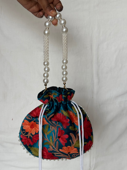 Round Potli bag with Kashmiri floral Aari embroidery - drawstring closure