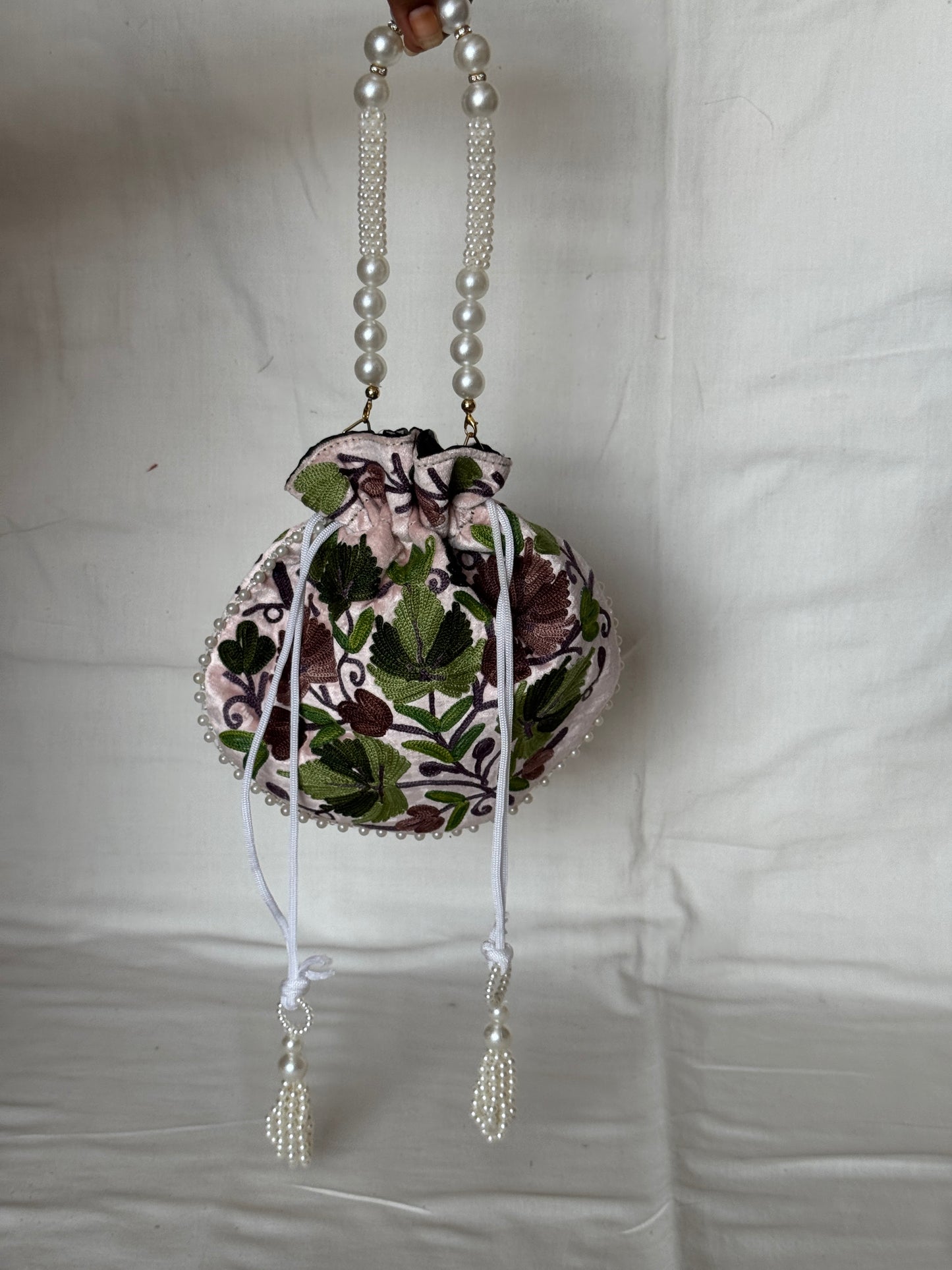 Round Potli bag with Kashmiri floral Aari embroidery - drawstring closure