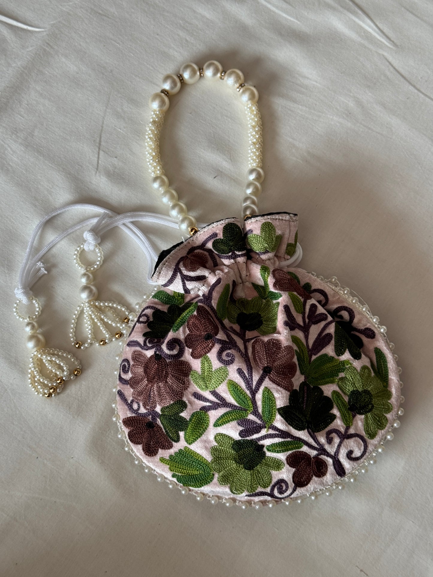 Round Potli bag with Kashmiri floral Aari embroidery - drawstring closure