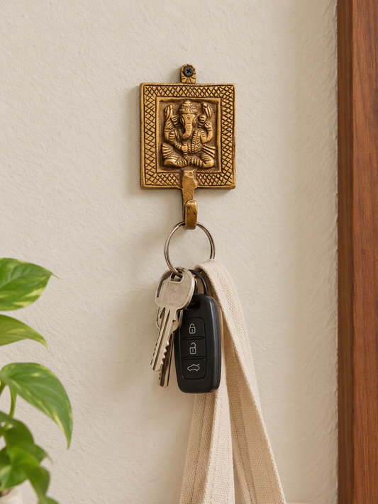 Handcrafted brass key hangers with figures carved on it