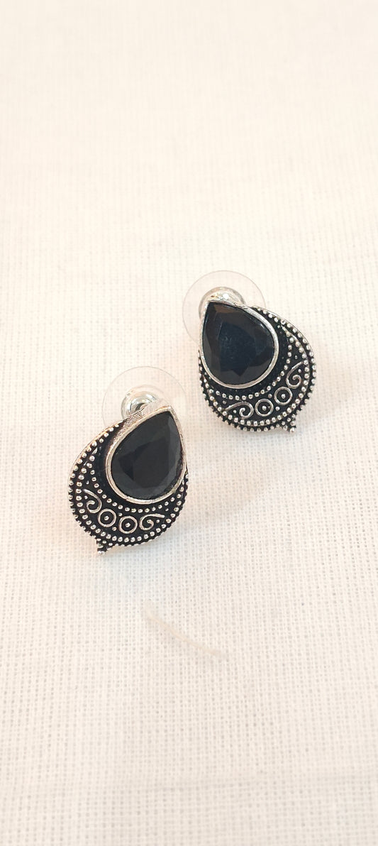 Black drop shaped stone stud earrings with silver detailing