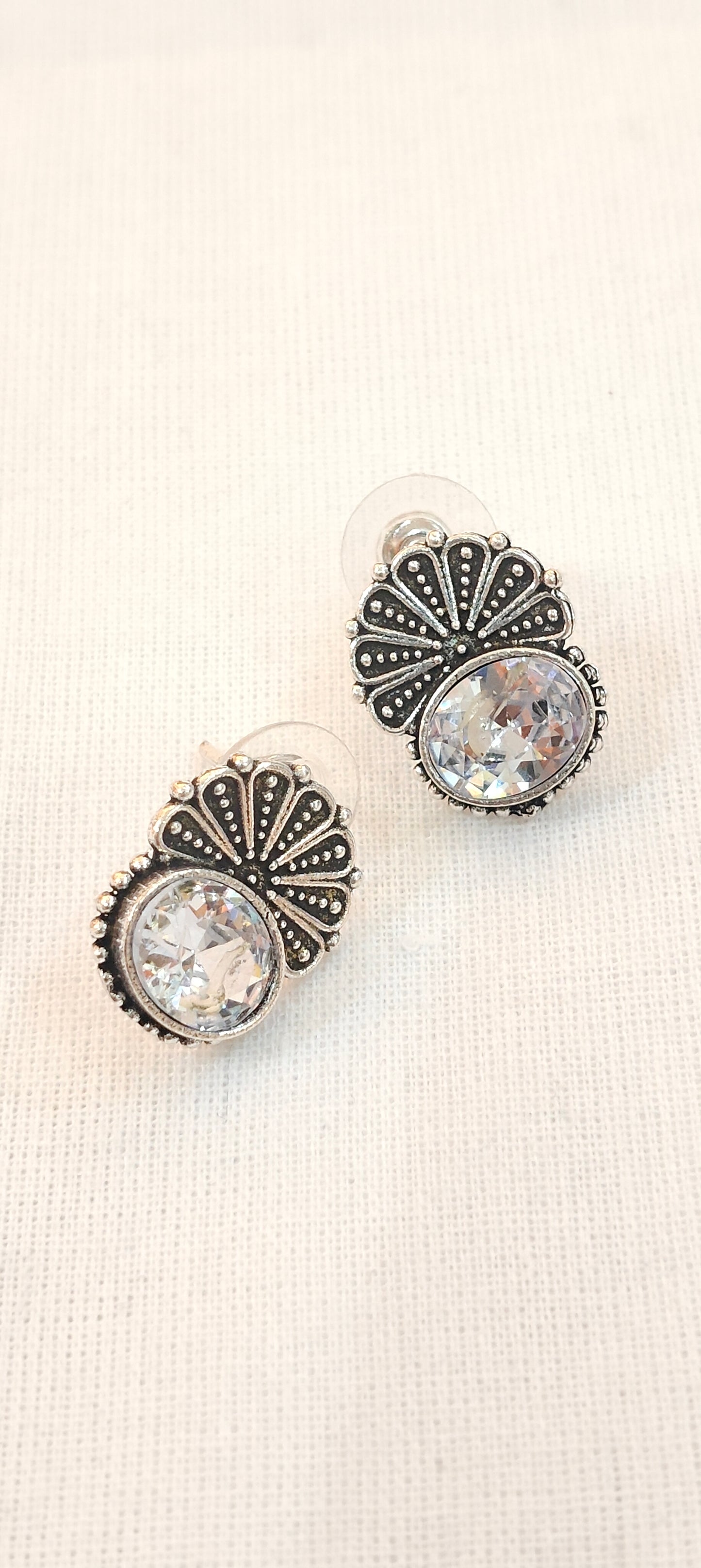 Crystal stone stud earrings with floral silver detailing