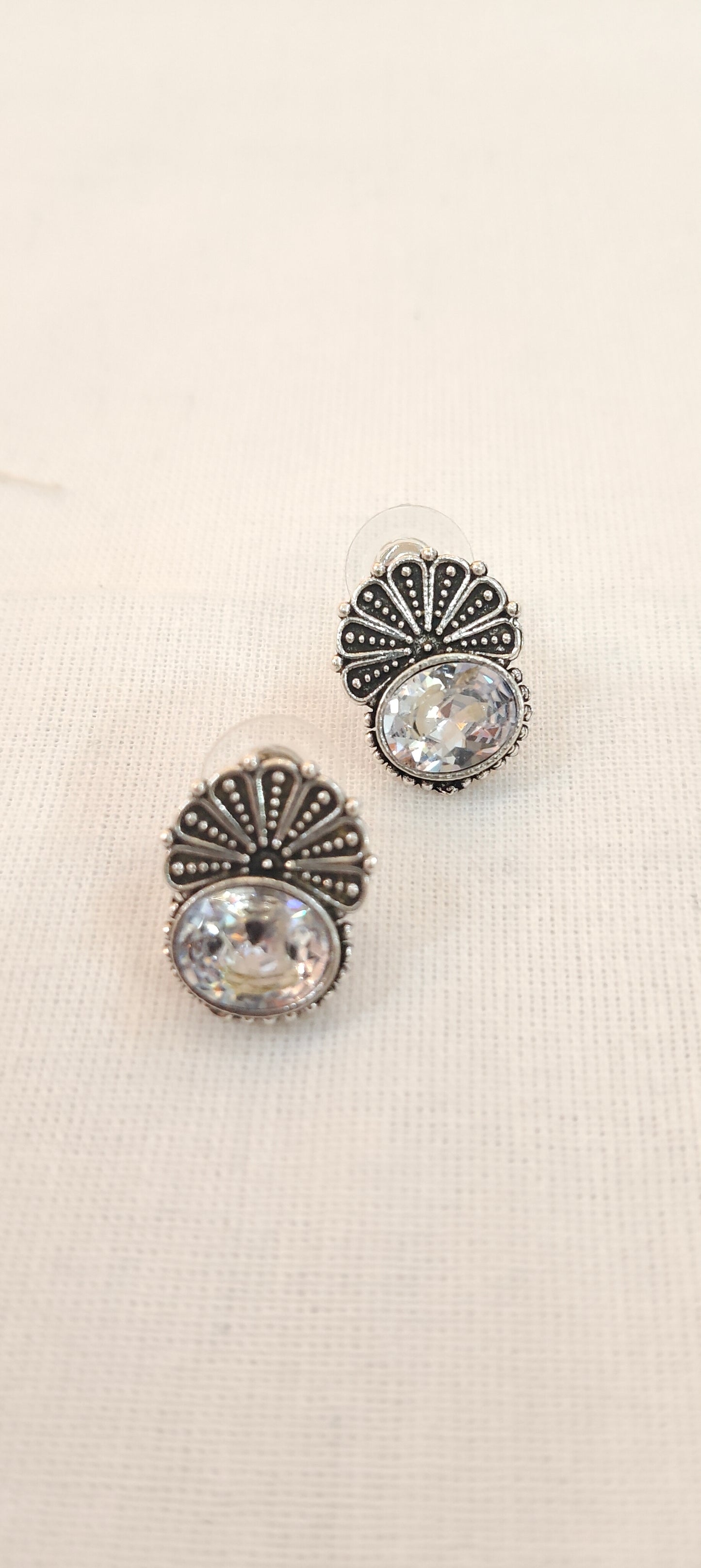 Crystal stone stud earrings with floral silver detailing