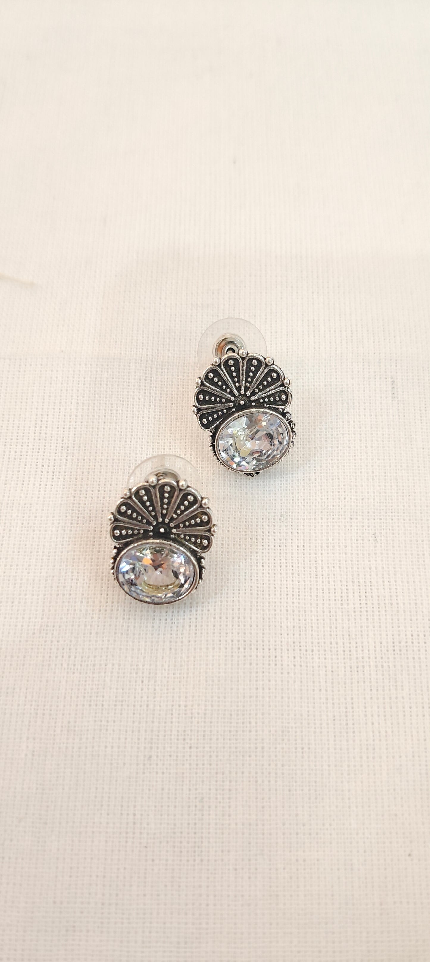 Crystal stone stud earrings with floral silver detailing