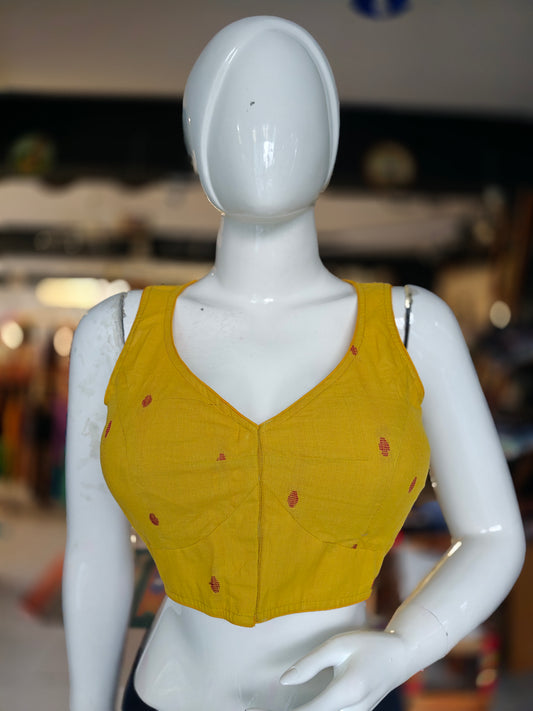 Mustard yellow dot prints front open sleeveless blouse with pads
