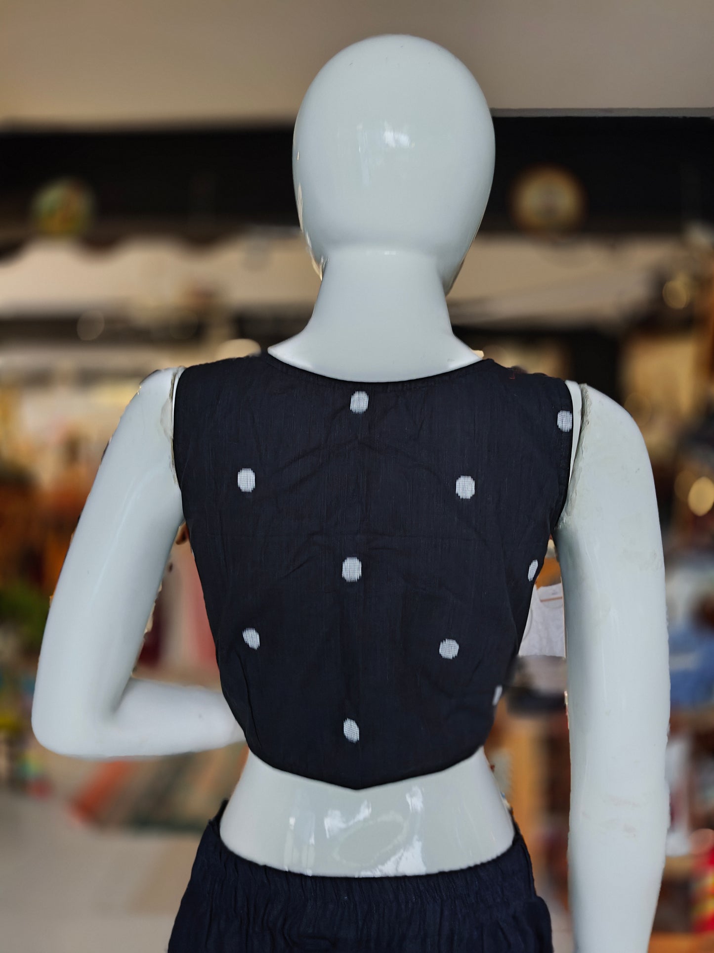 Black cotton with dot prints front open sleeveless handloom cotton blouse with pads