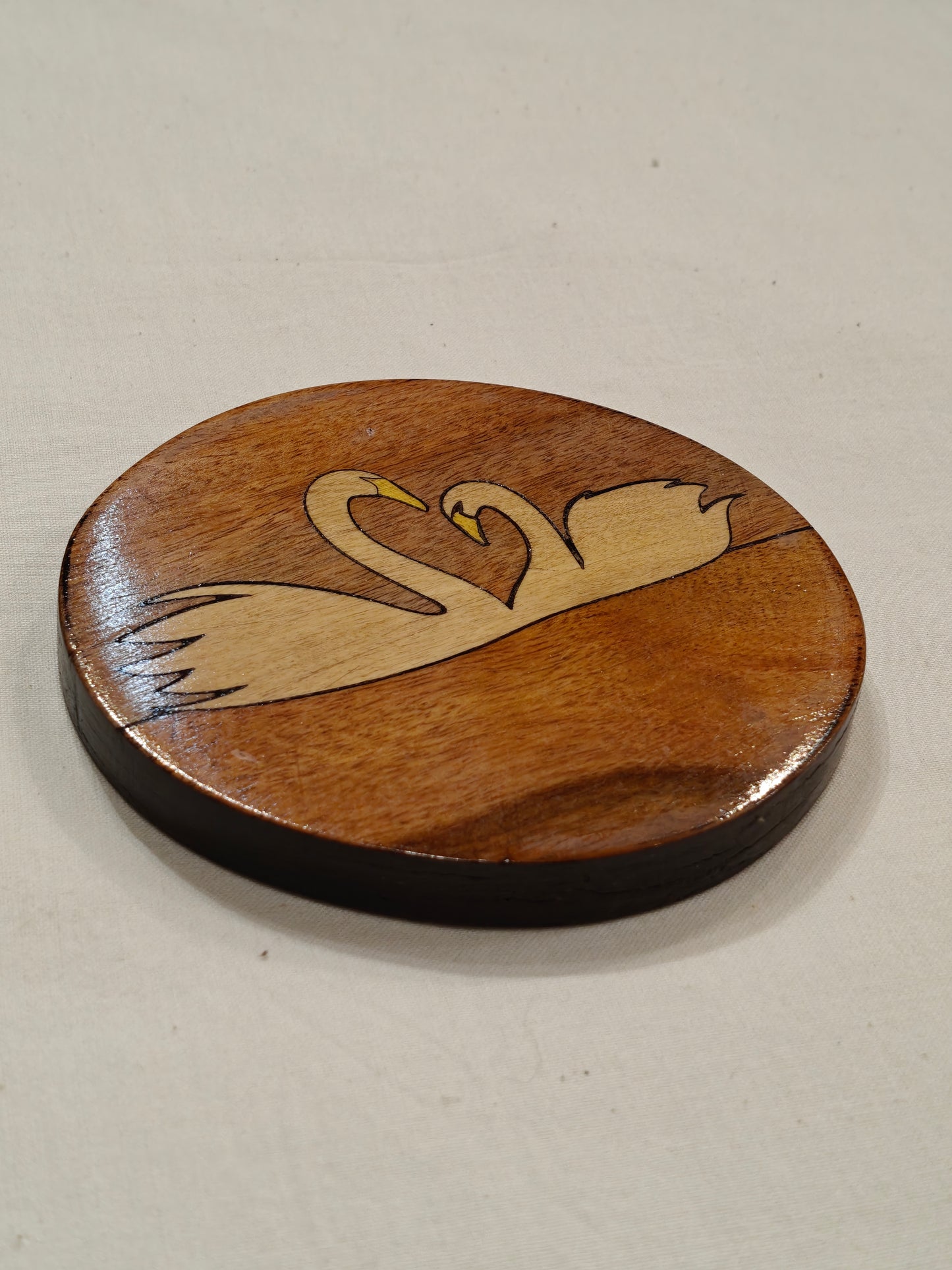 Handcrafted Wooden coaster with Swans design on it