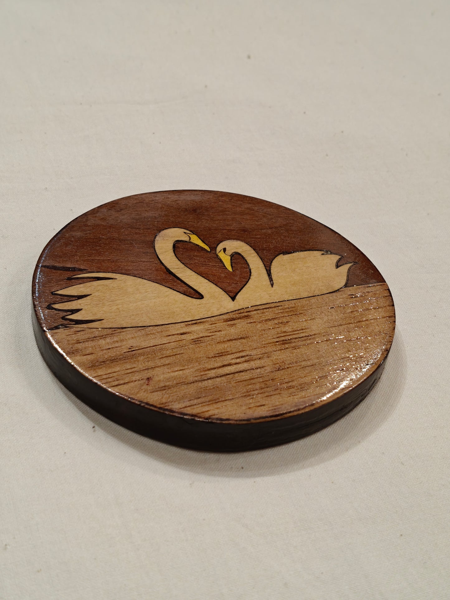 Handcrafted Wooden coaster with Swans design on it
