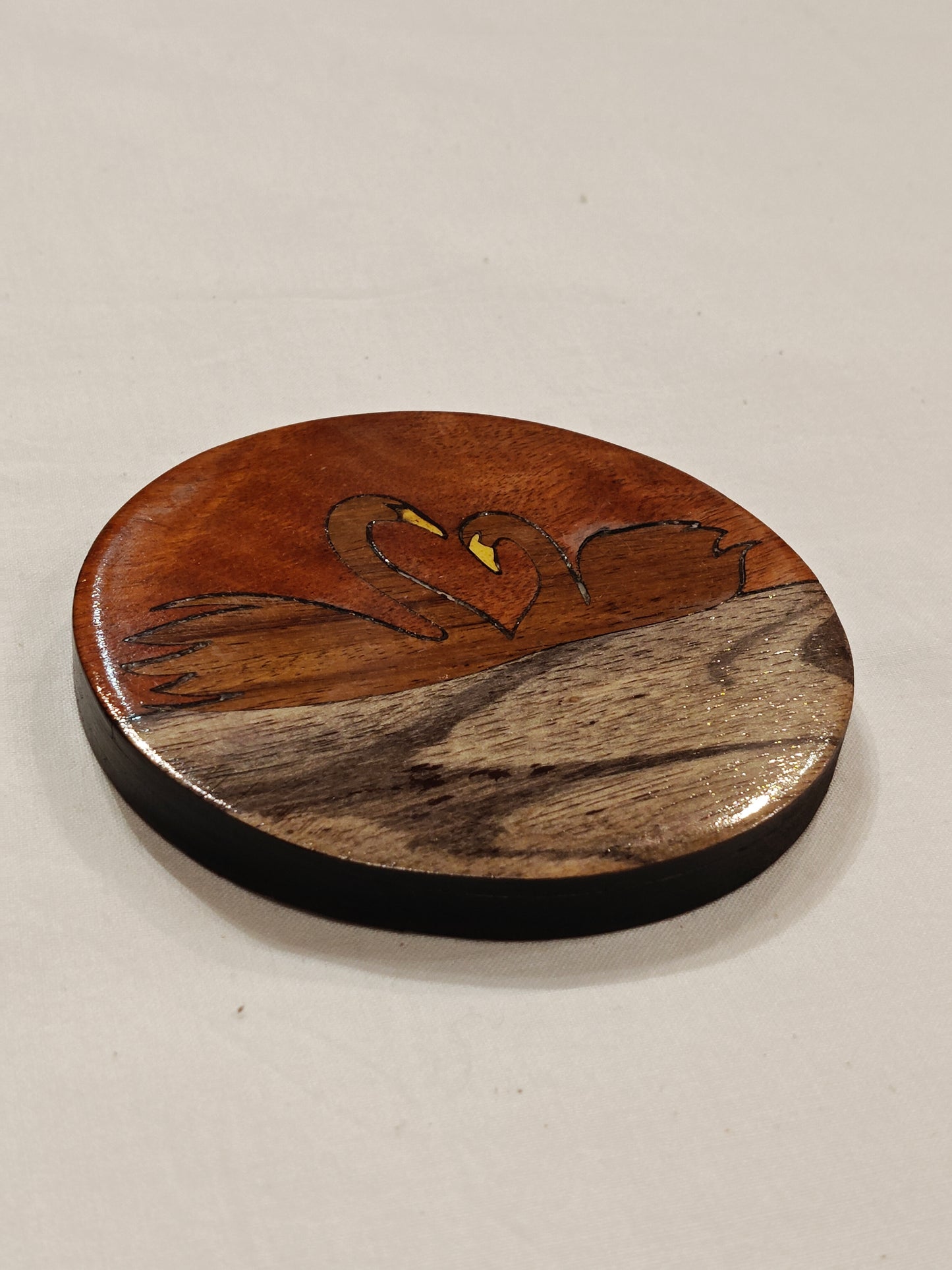 Handcrafted Wooden coaster with Swans design on it