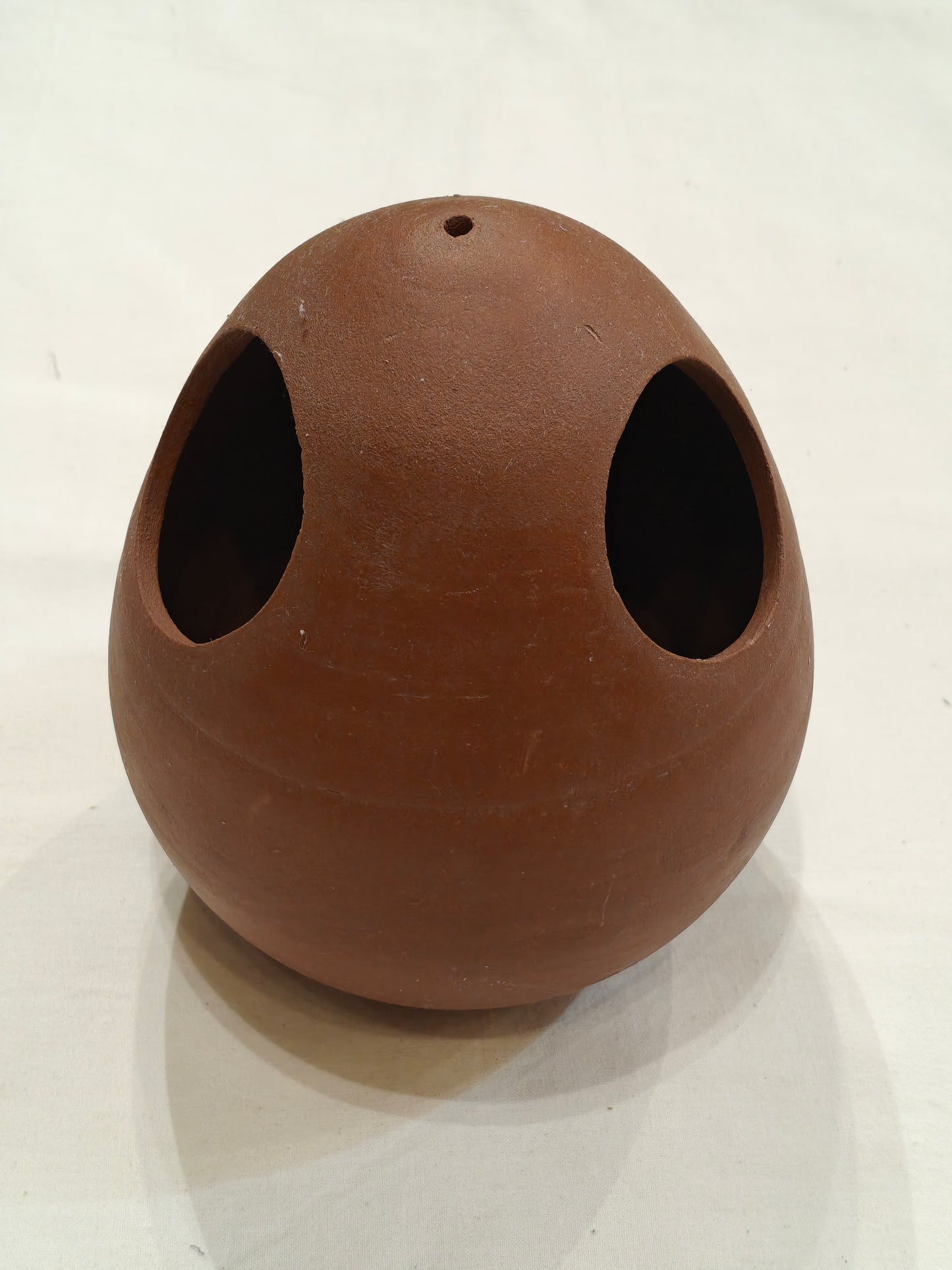 Handcrafted egg shaped t-light holder made of clay