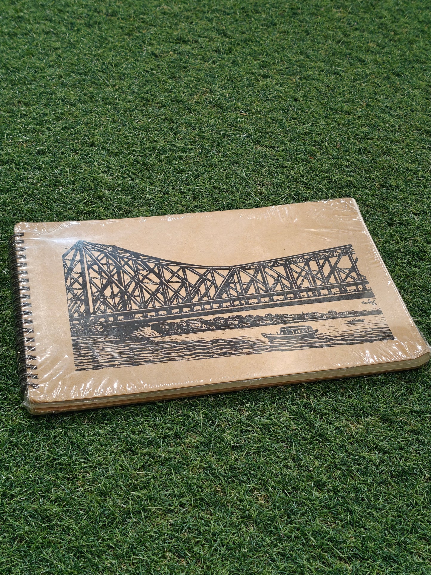 Hand made paper sketchbook with brown board cover and spiral binded