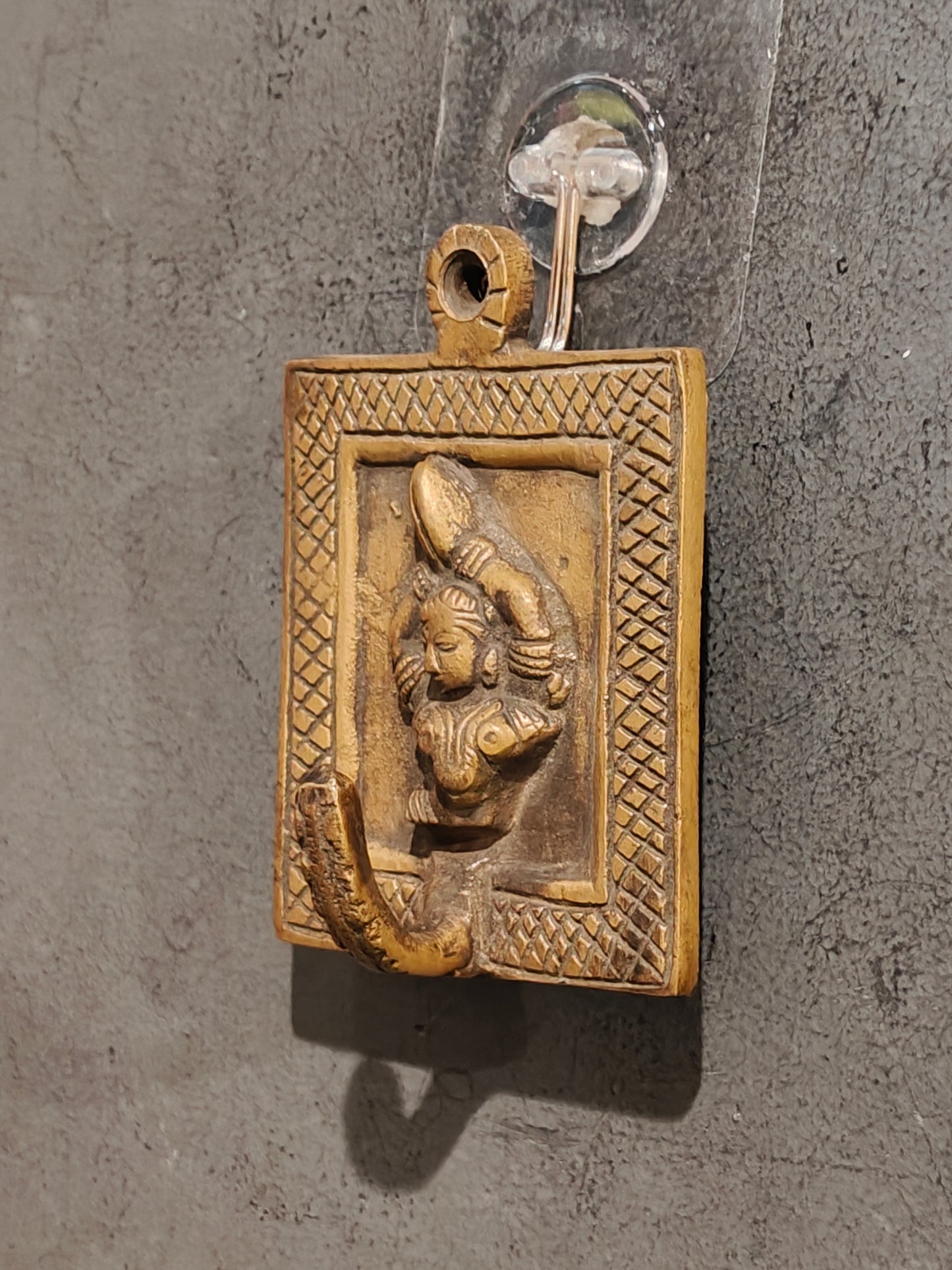 Handcrafted  hangers with figures carved on it - brass