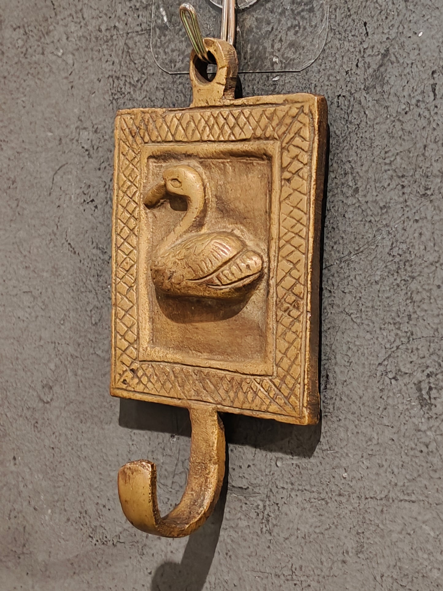 Handcrafted  hangers with figures carved on it - brass