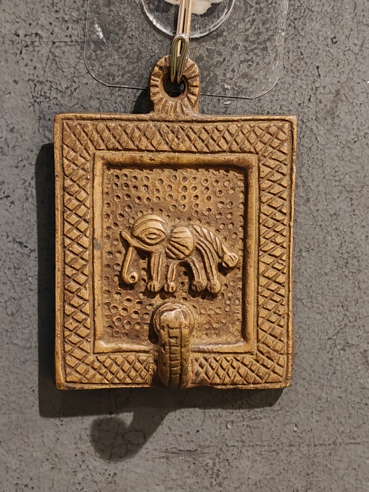 Handcrafted  hangers with figures carved on it - brass