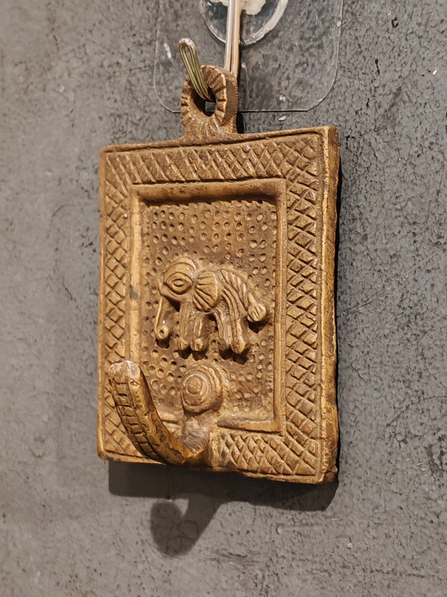 Handcrafted  hangers with figures carved on it - brass