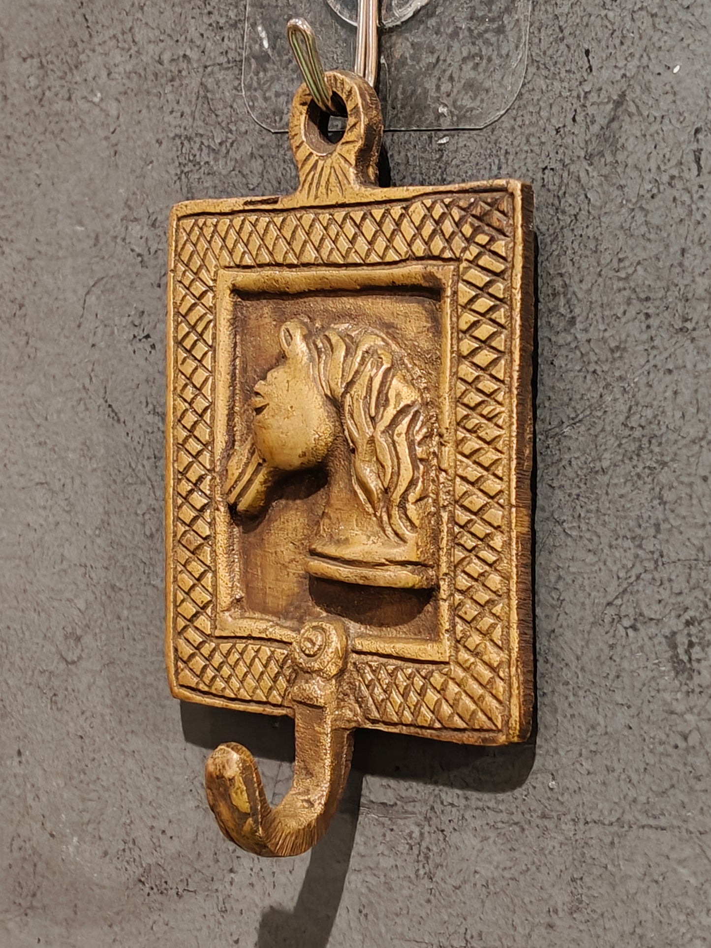 Handcrafted  hangers with figures carved on it - brass