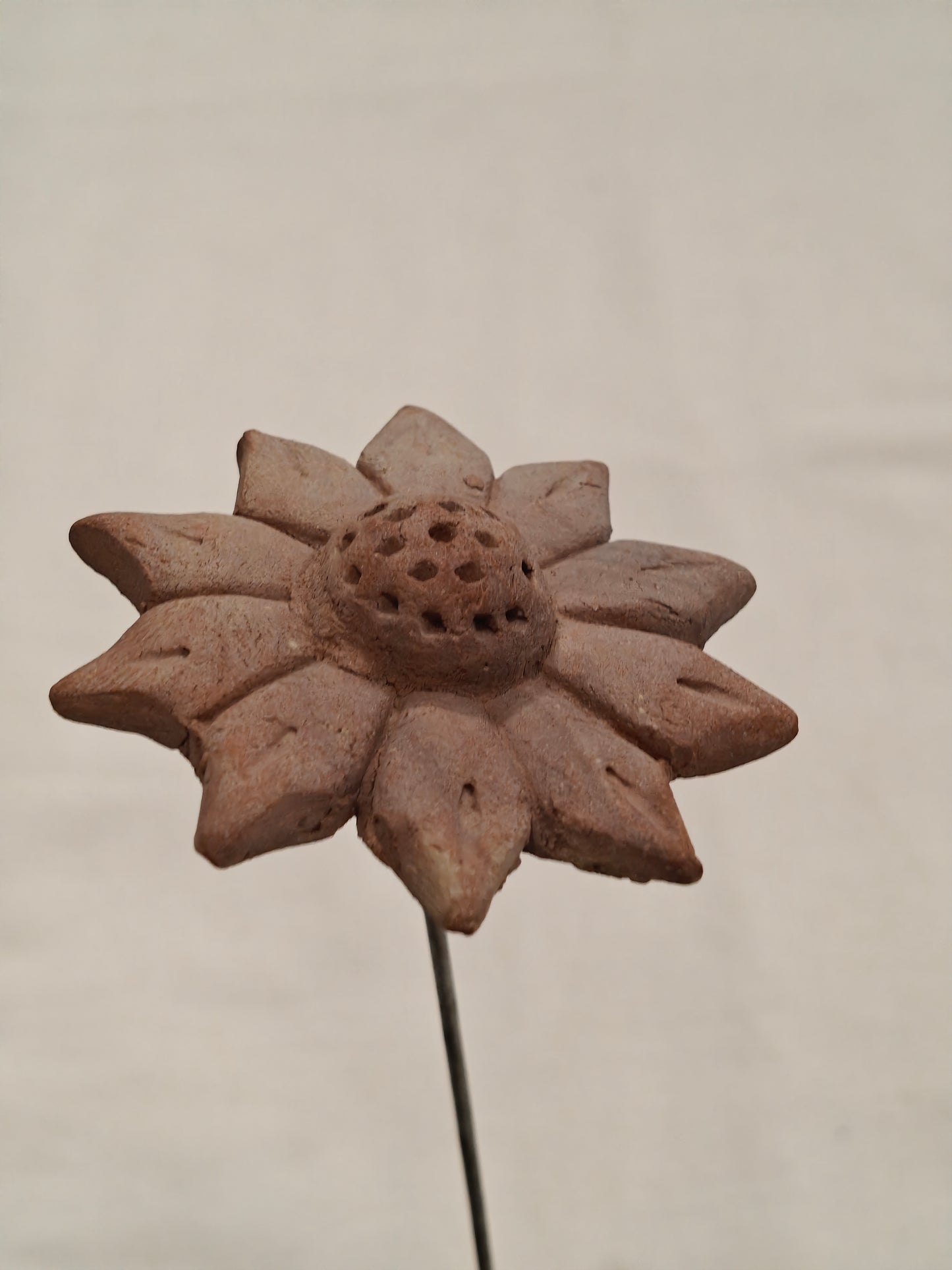 Handcrafted with clay garden stick