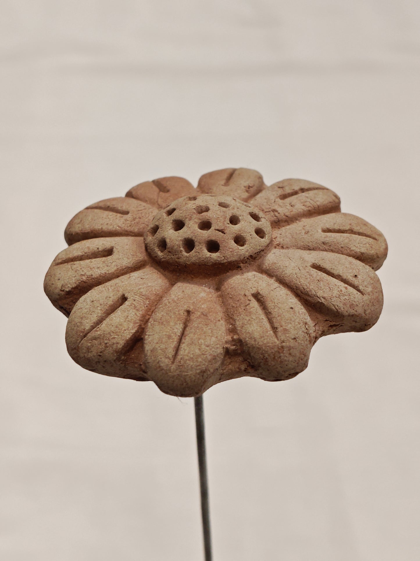 Handcrafted with clay garden stick