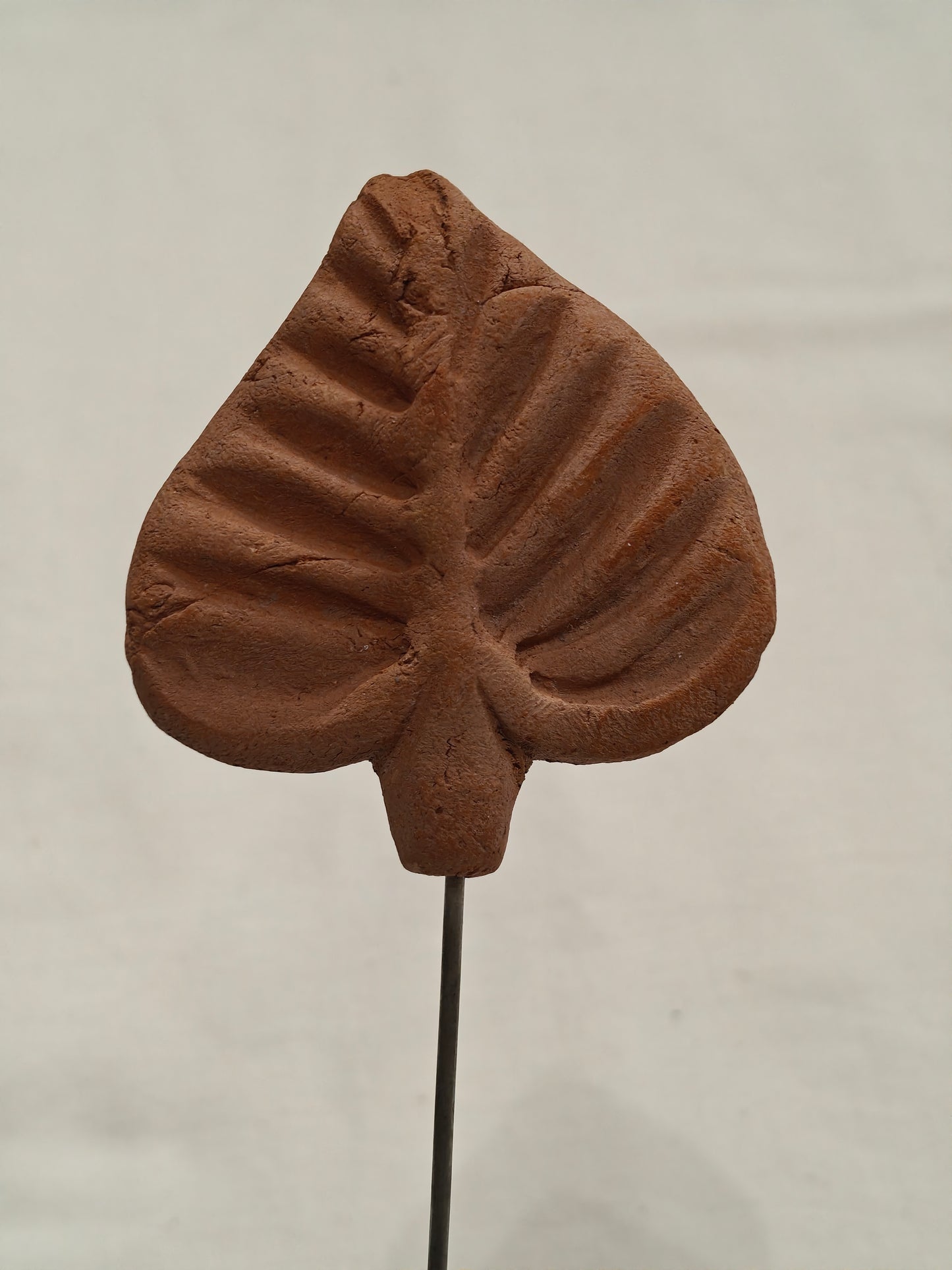 Handcrafted with clay garden stick