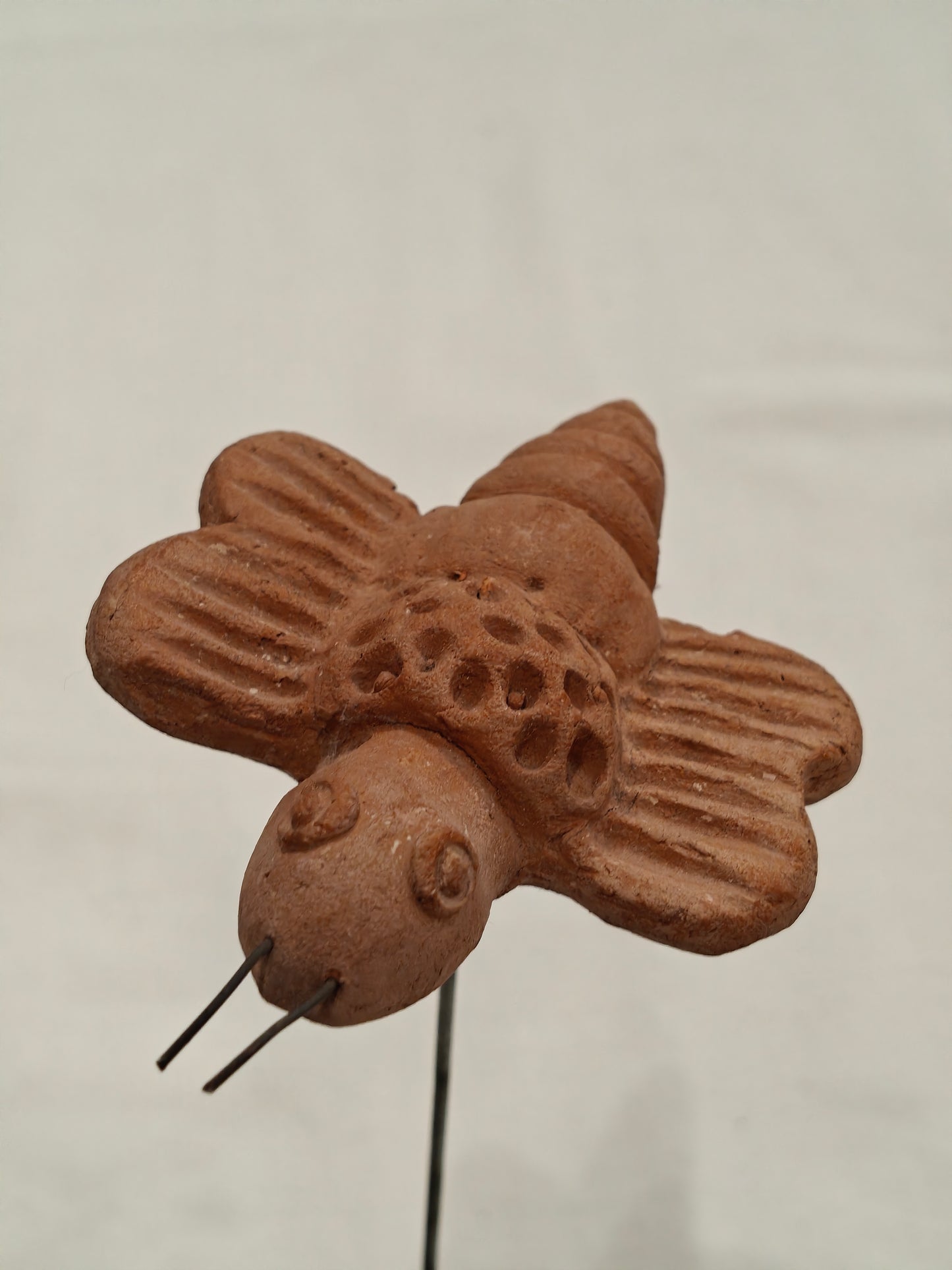 Handcrafted with clay garden stick