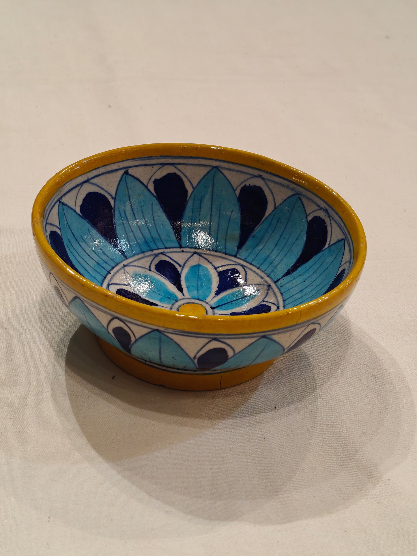 Blue, Yellow and white floral design blue pottery bowl
