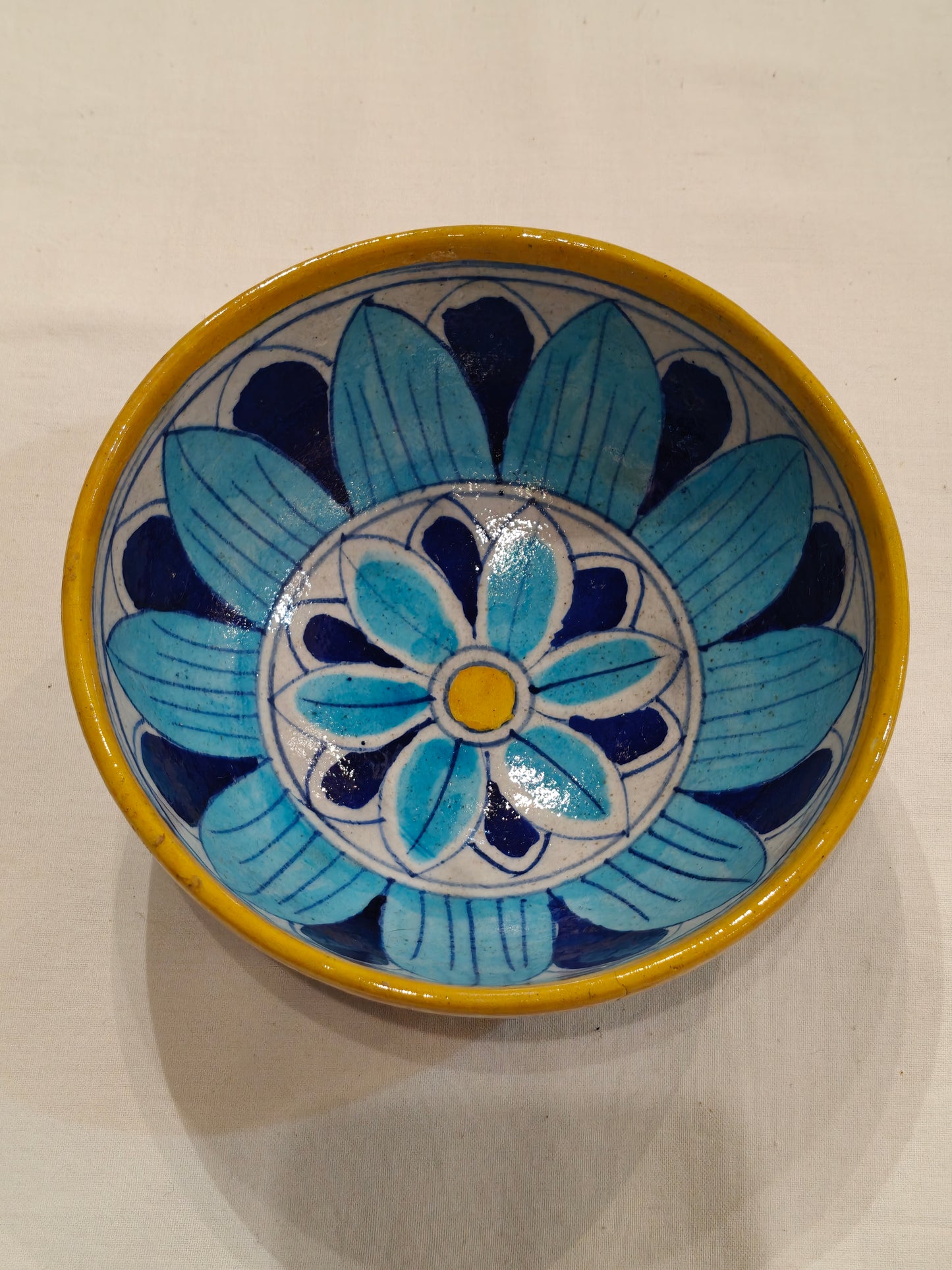 Blue, Yellow and white floral design blue pottery bowl
