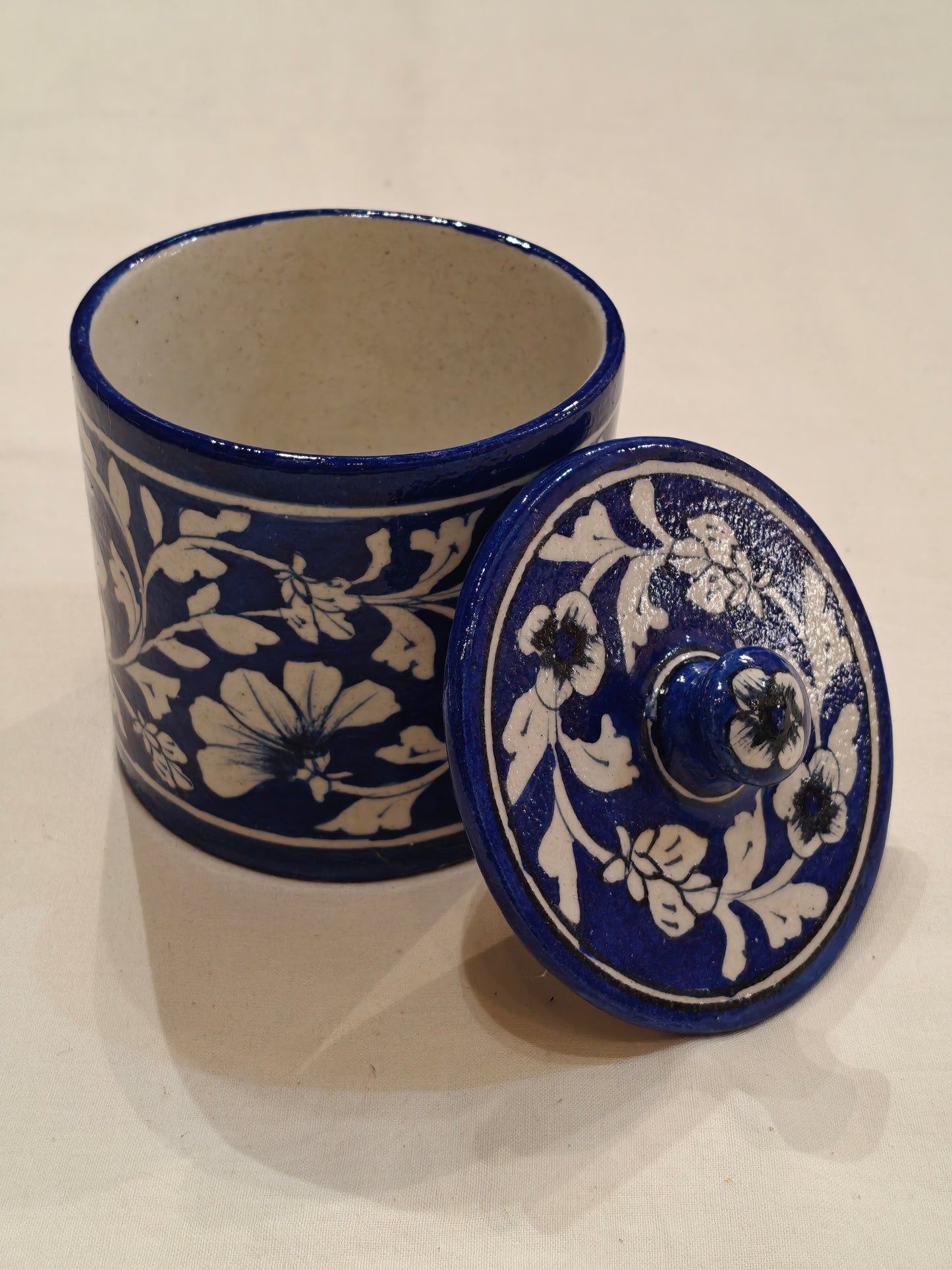 Blue and white floral design blue pottery handcrafted container with lid