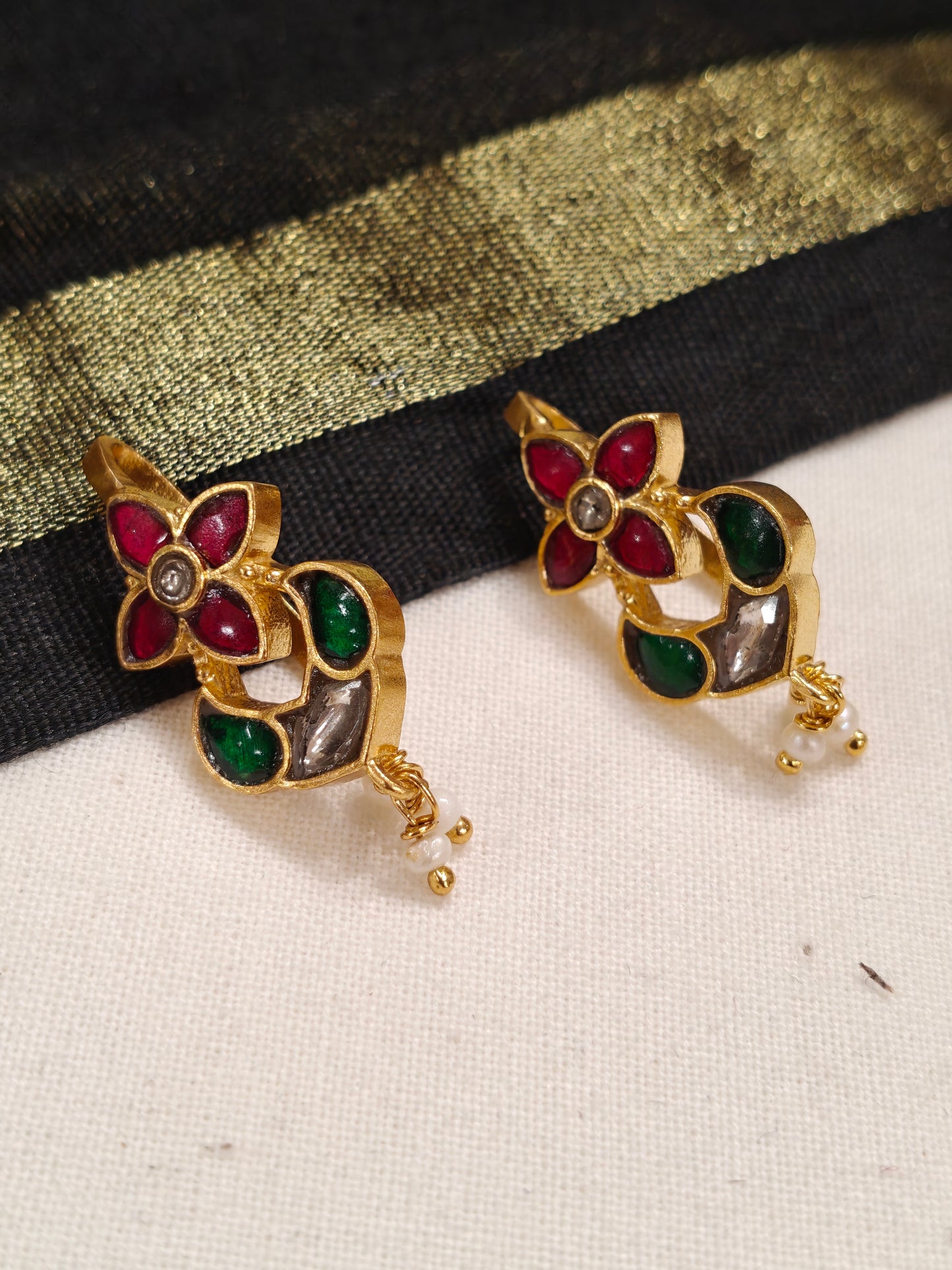 Four petal flower shaped silver ear clip ons in Pink and green stones