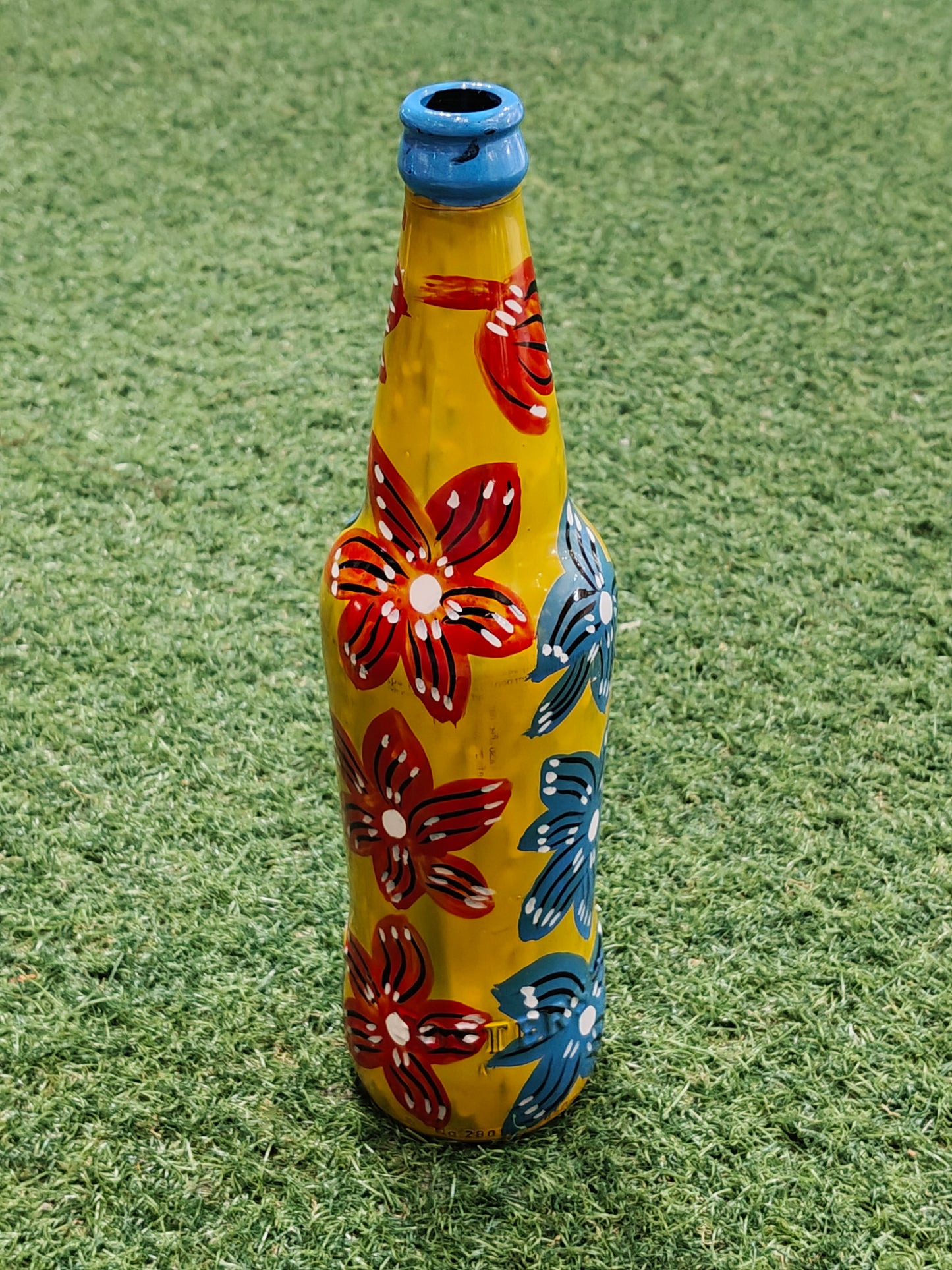 Glass bottle with Handpainted flowers on it -  flower vase