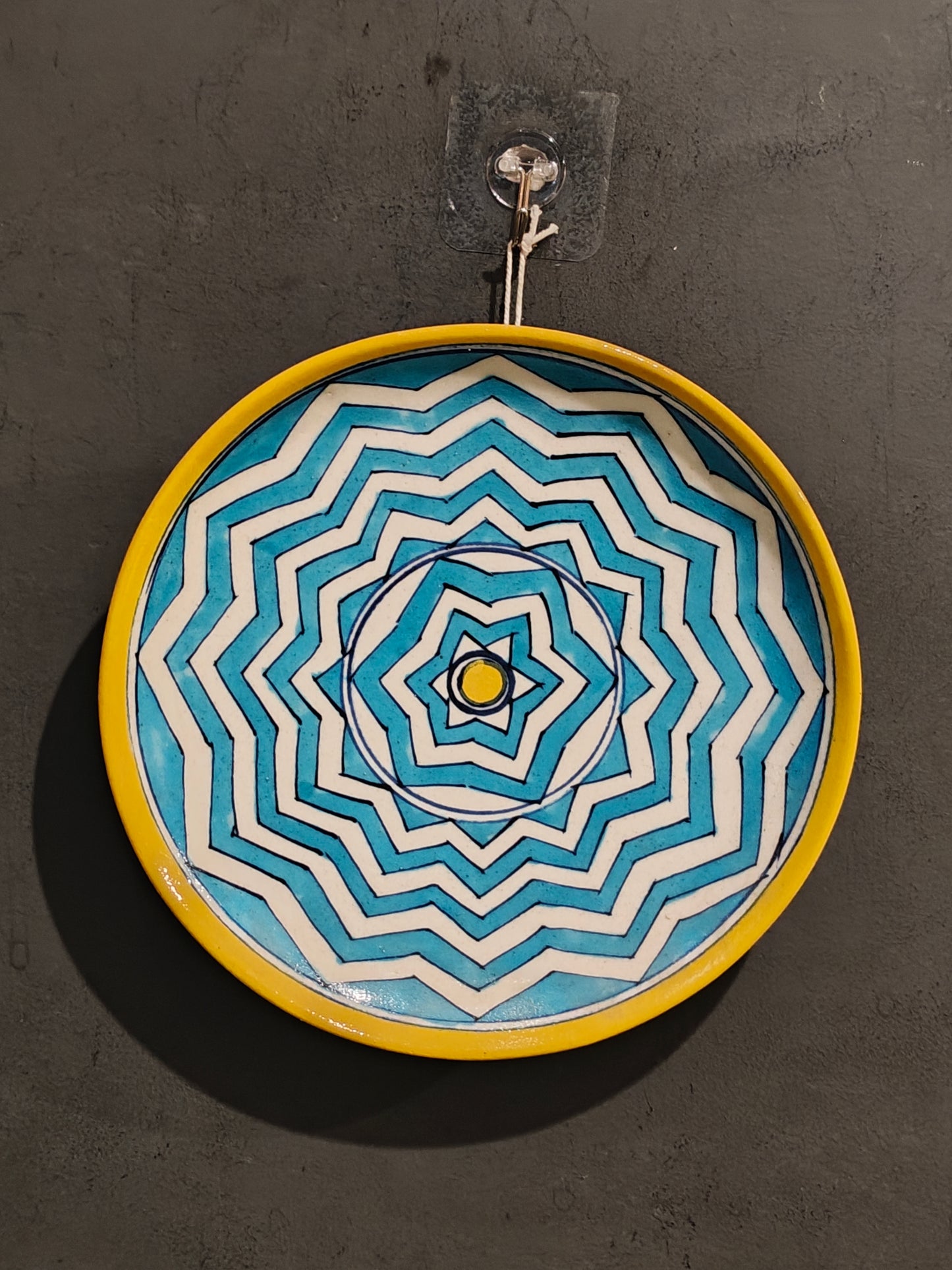 Blue,yellow and white flower painted blue pottery wall plate