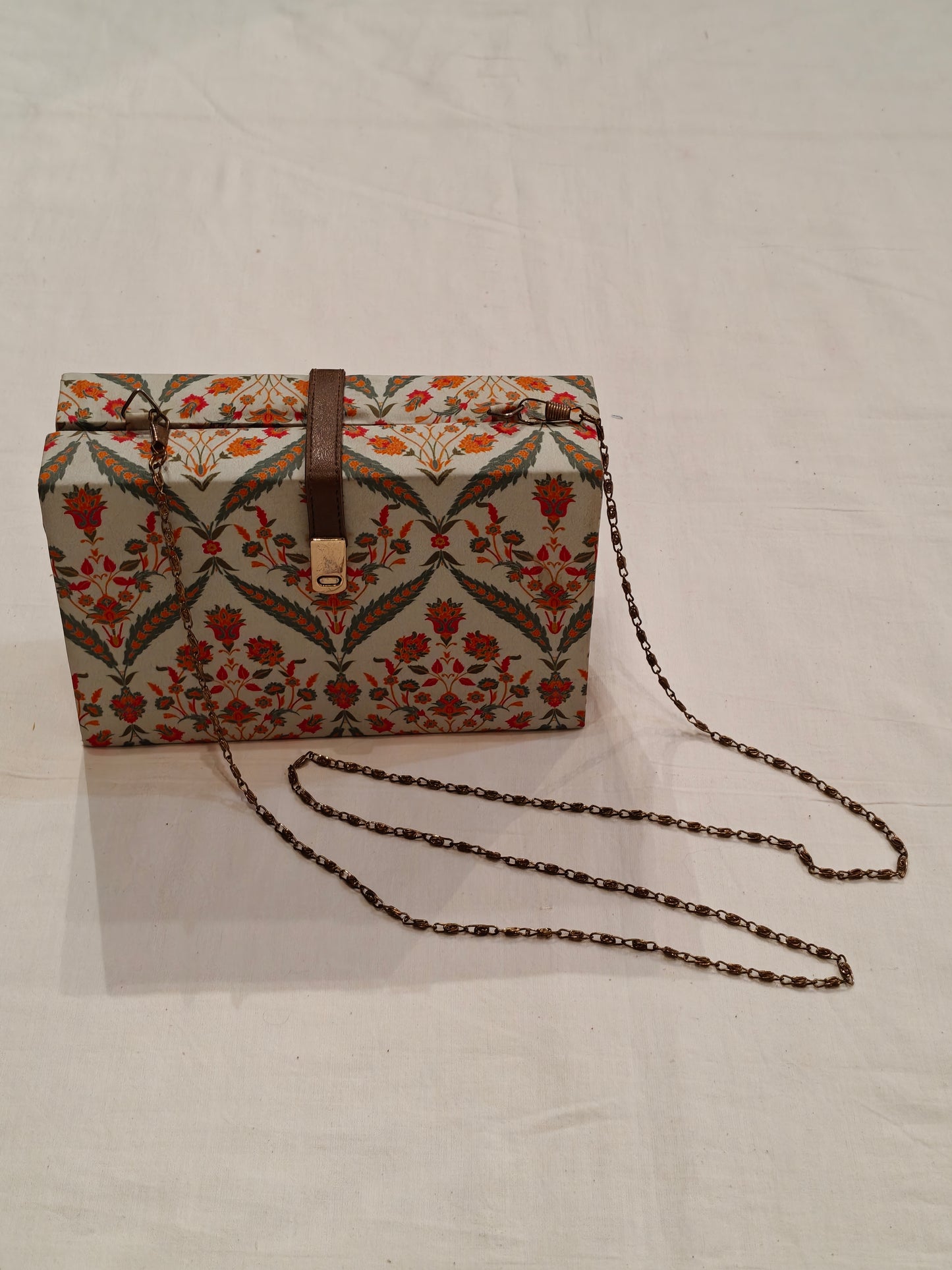 Floral fabric covered chain sling bag