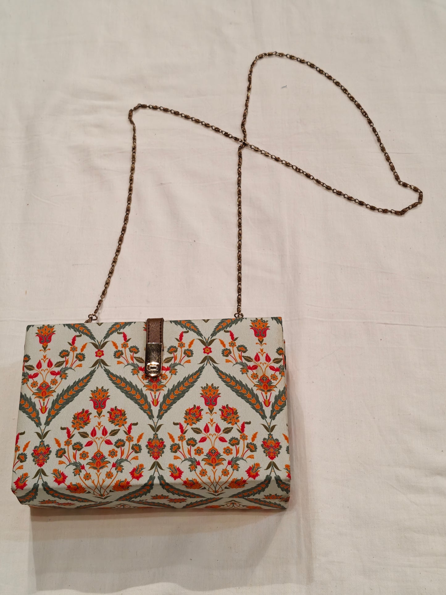 Floral fabric covered chain sling bag