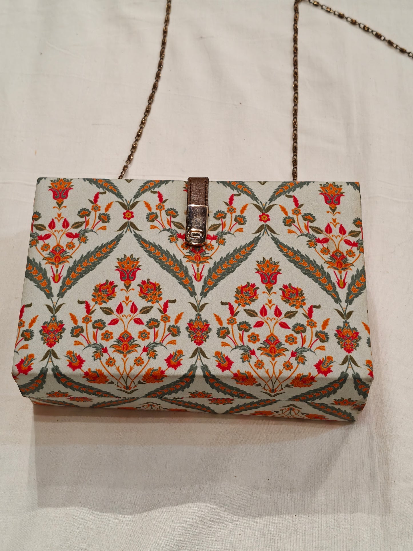 Floral fabric covered chain sling bag