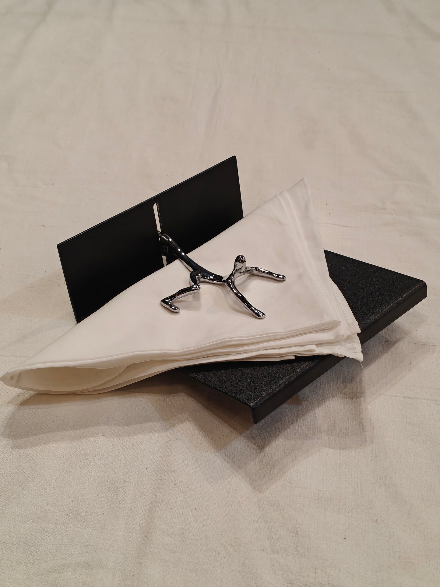 Quirky napkin holder - man all over the place to save your tissues from flying off