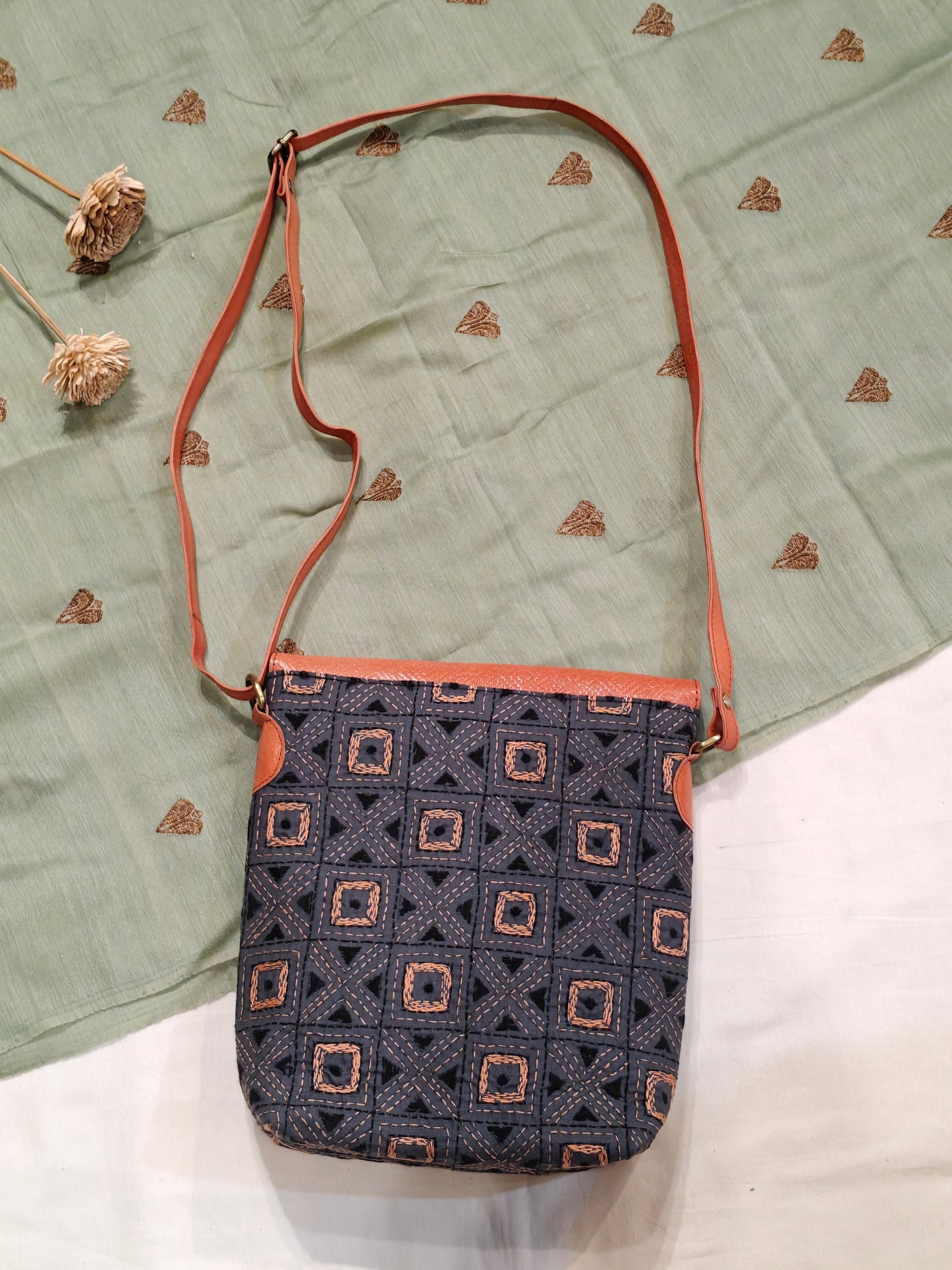 Kantha embroidered fabric with embossed leather flap - hand crafted adjustable length bag