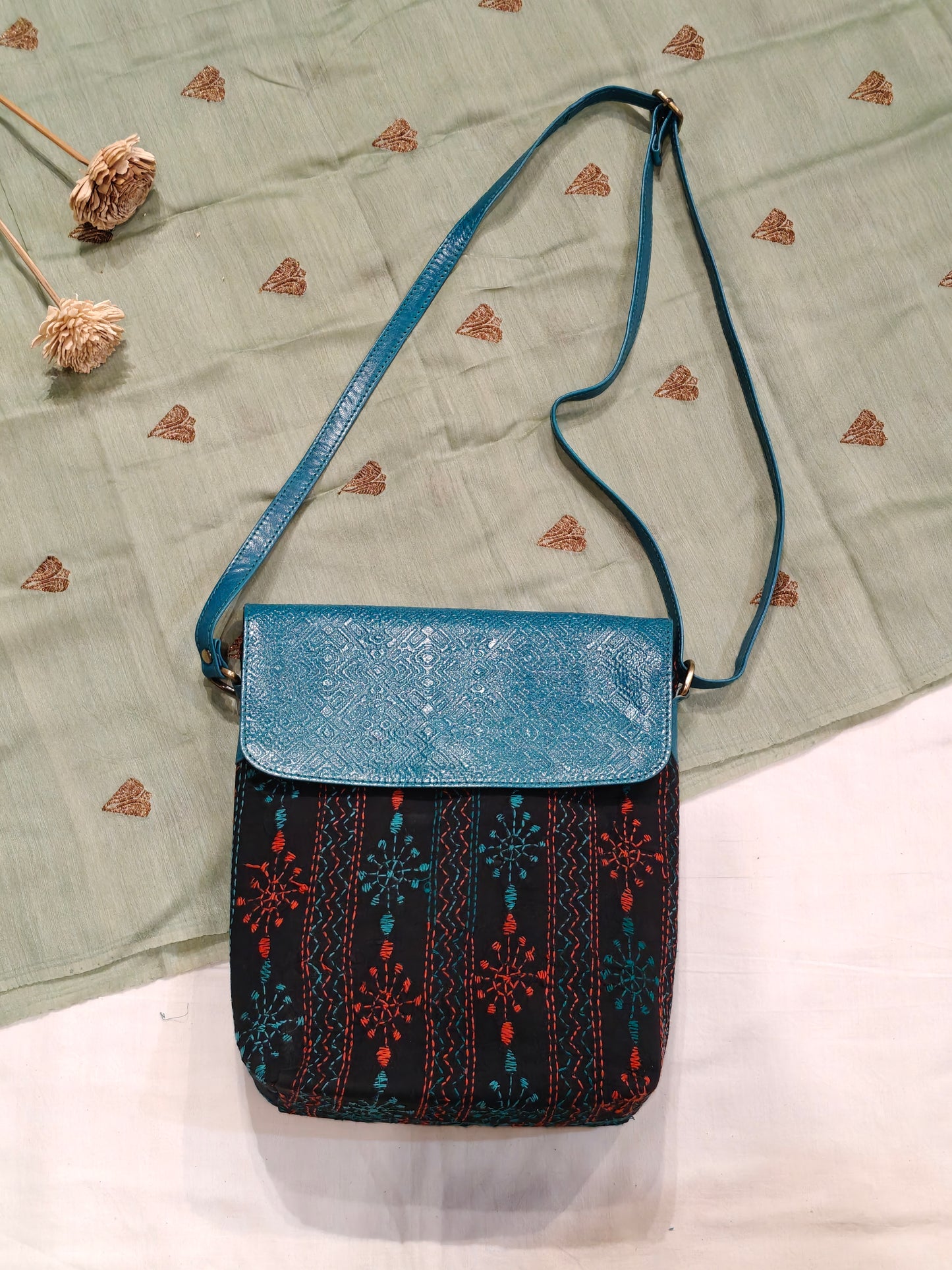 Kantha embroidered fabric with embossed leather flap - hand crafted adjustable length bag