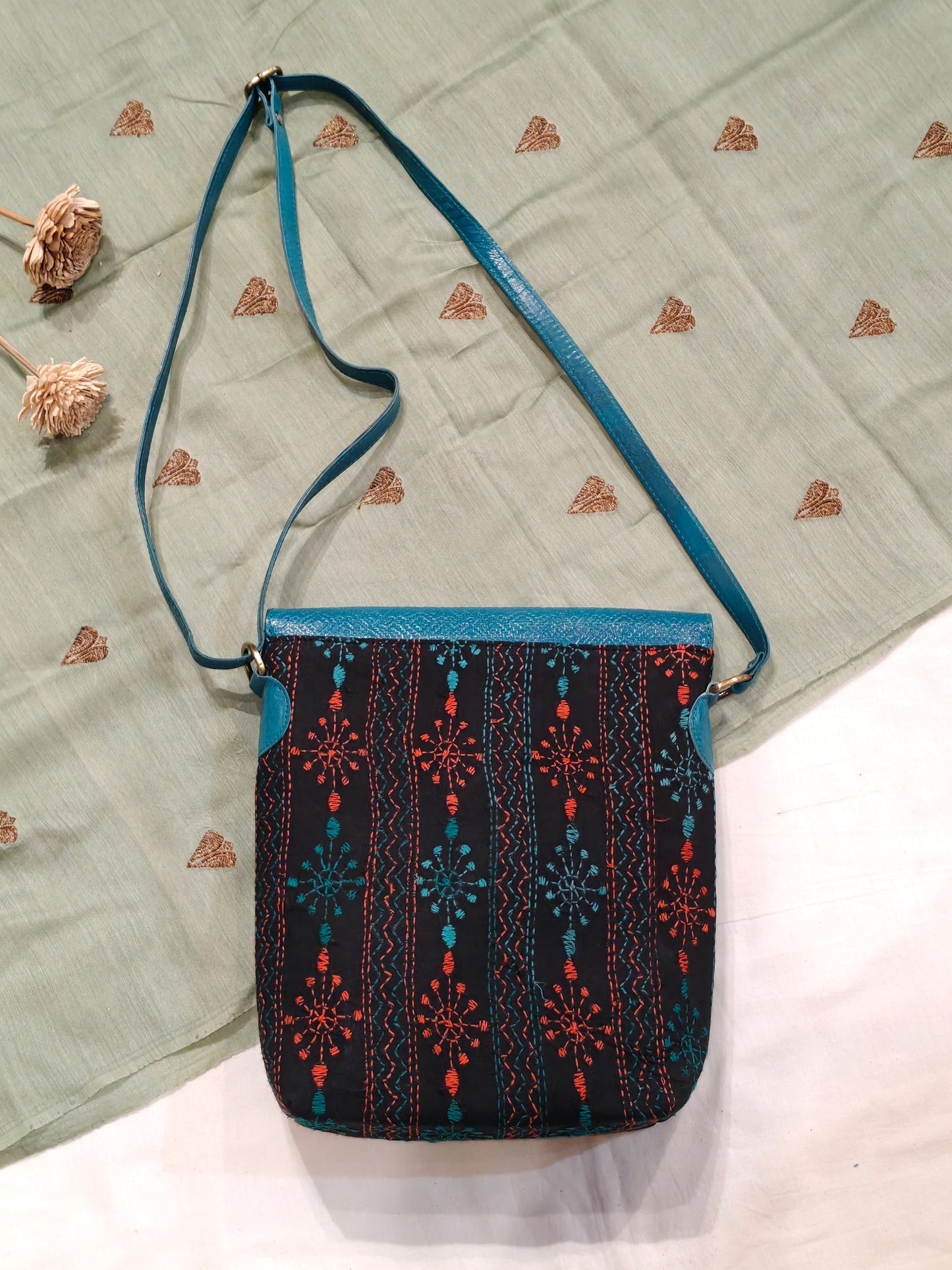 Kantha embroidered fabric with embossed leather flap - hand crafted adjustable length bag