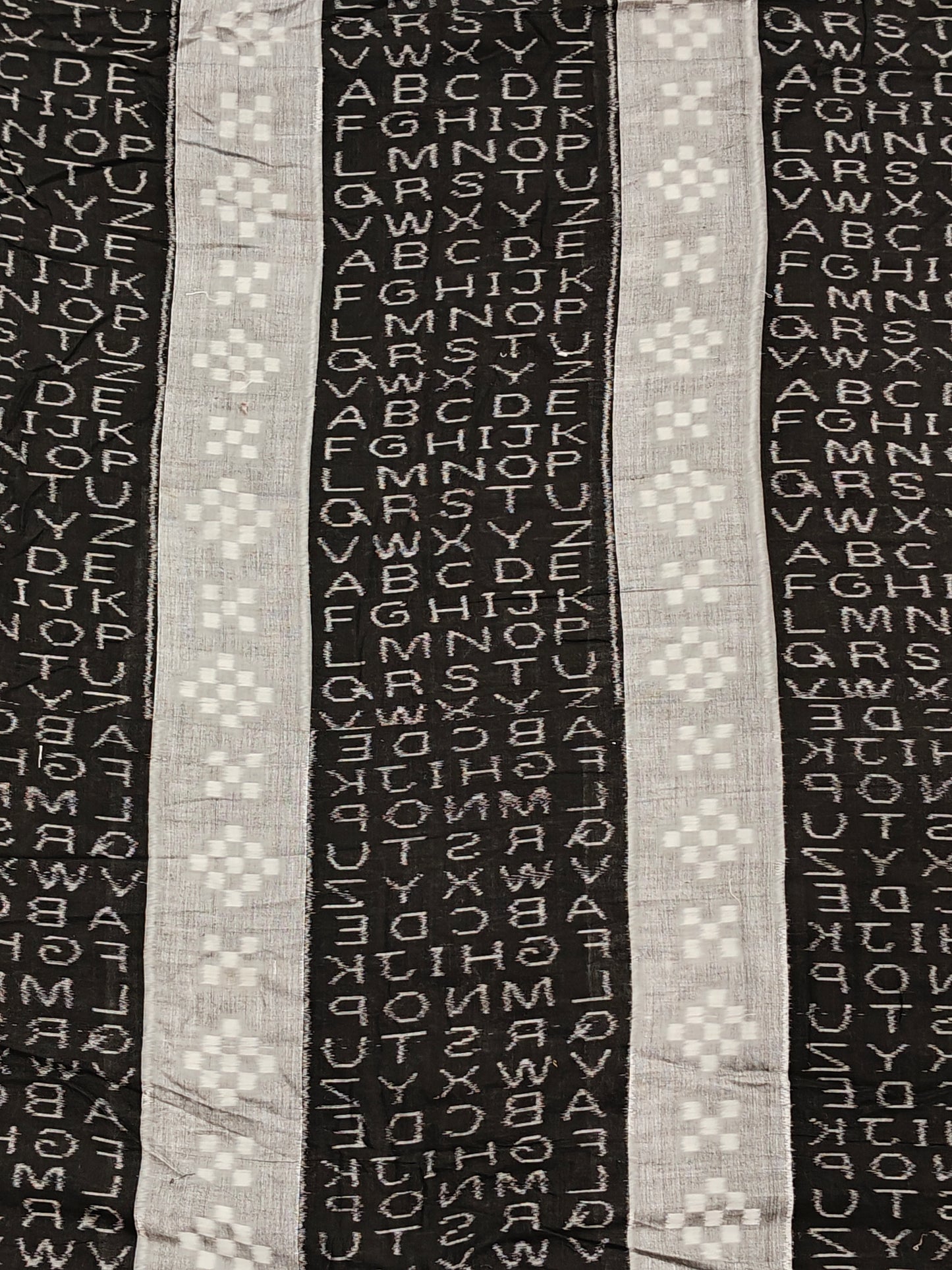 Black and grey alphabets design ikat tie and dye handloom cotton fabric