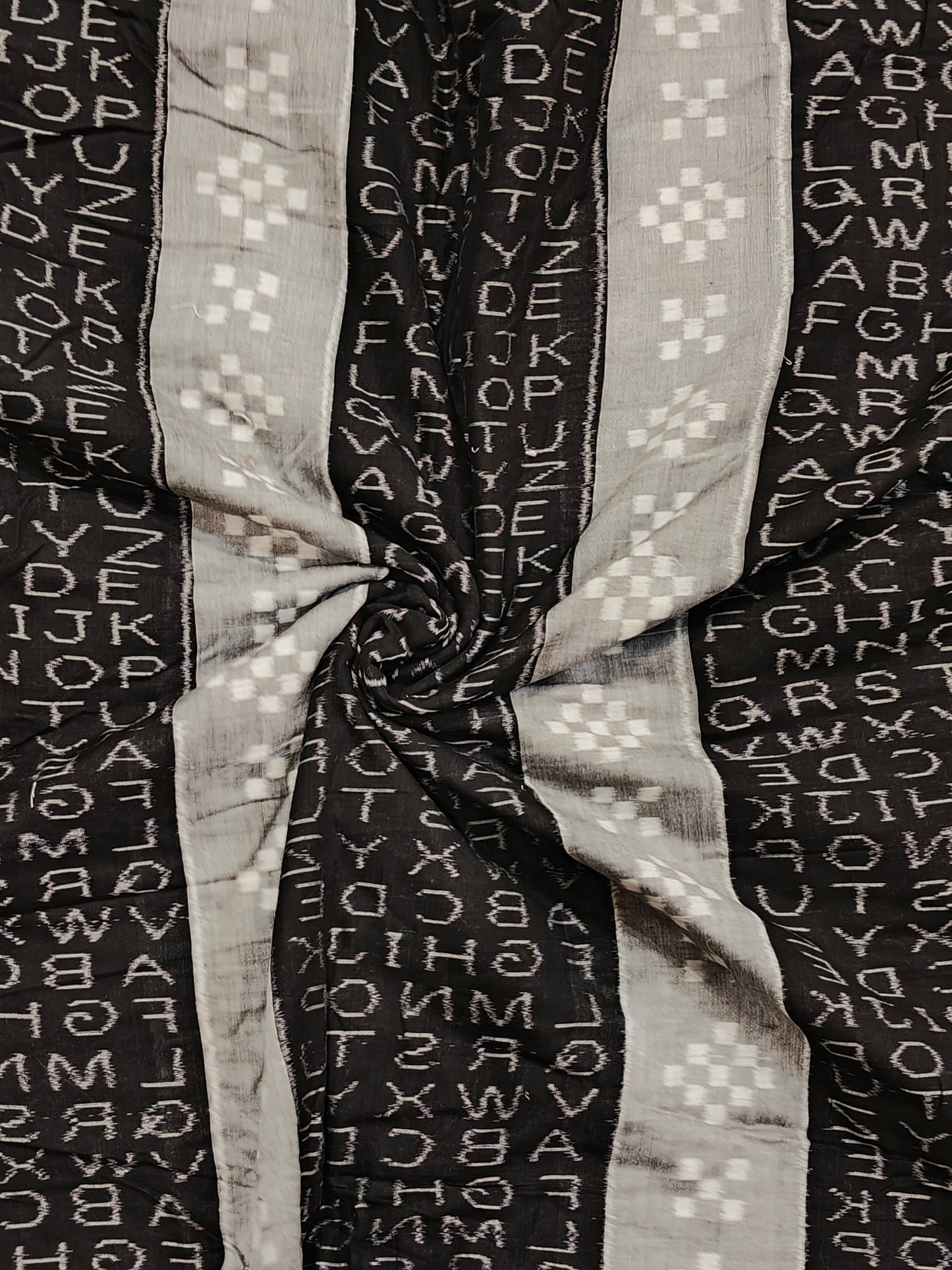 Black and grey alphabets design ikat tie and dye handloom cotton fabric