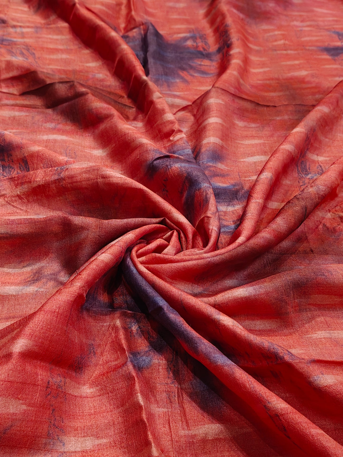 Red and purple thigh reeled tussar silk clamp dyed handwoven fabric