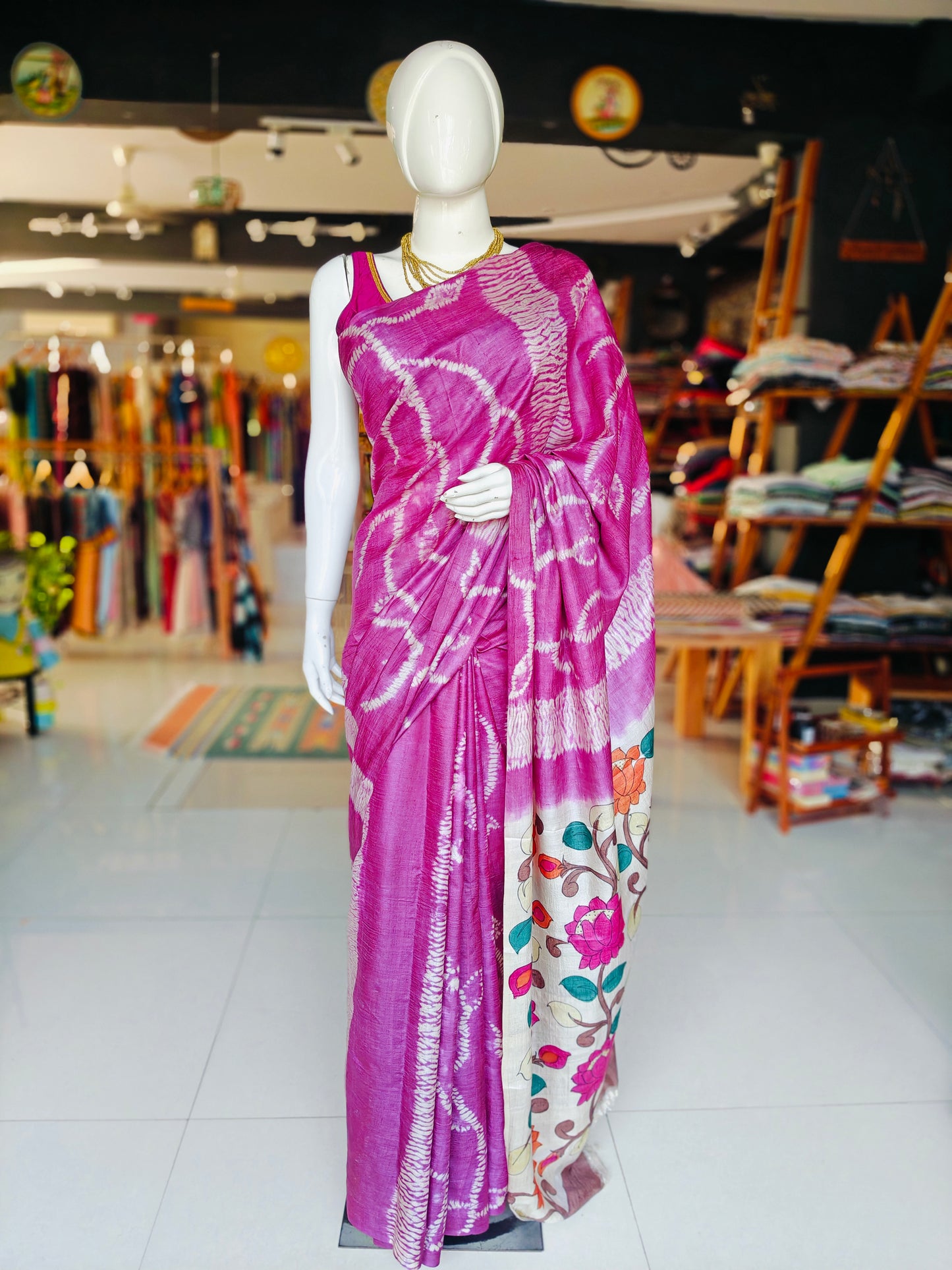 Pink tussar silk saree with needle shibori body and hand painted lotus design pallu