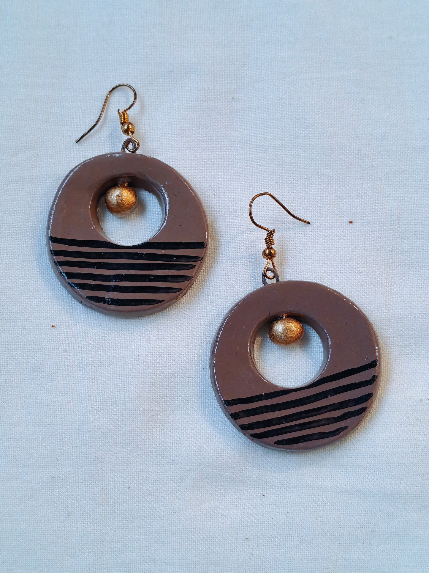 Circular handcrafted, handpainted terracotta hook earrings