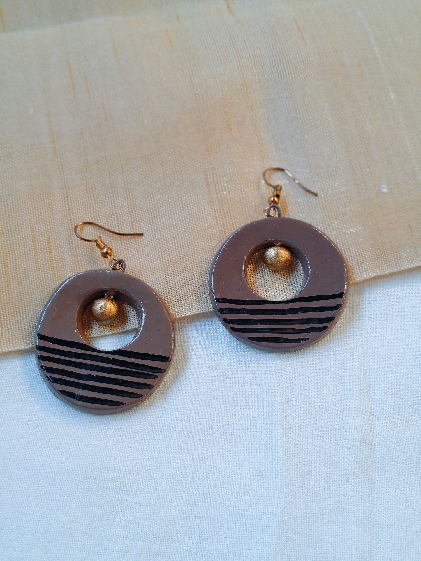 Circular handcrafted, handpainted terracotta hook earrings