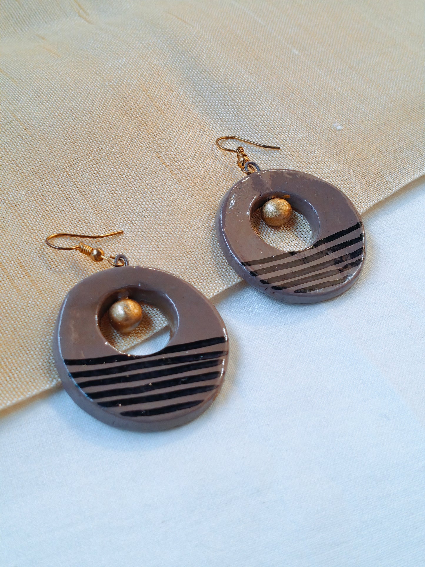 Circular handcrafted, handpainted terracotta hook earrings