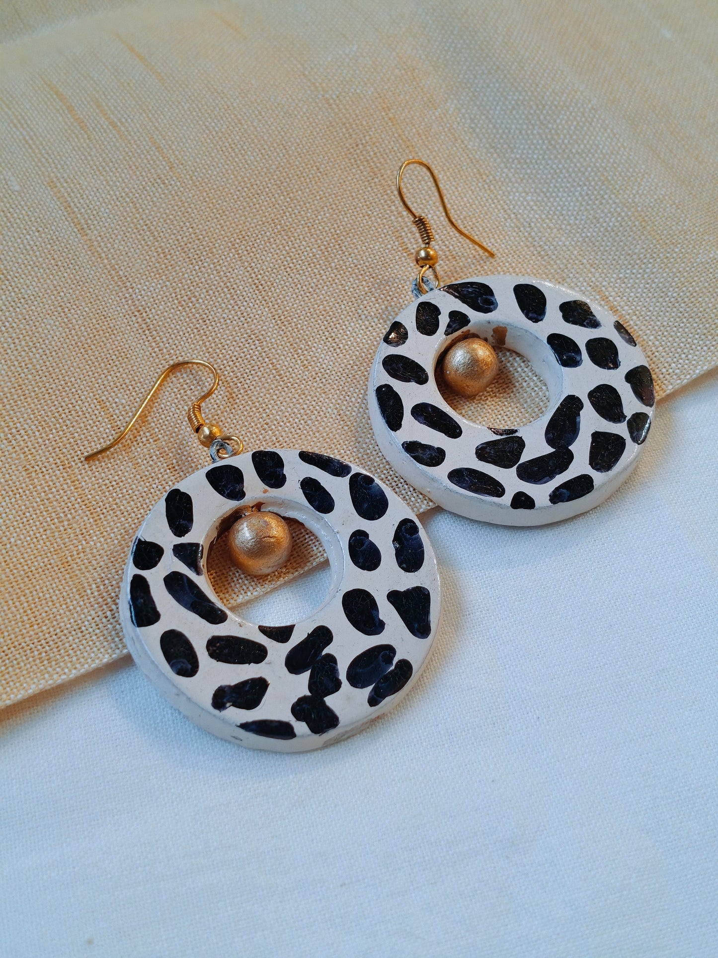Circular handcrafted, handpainted terracotta hook earrings