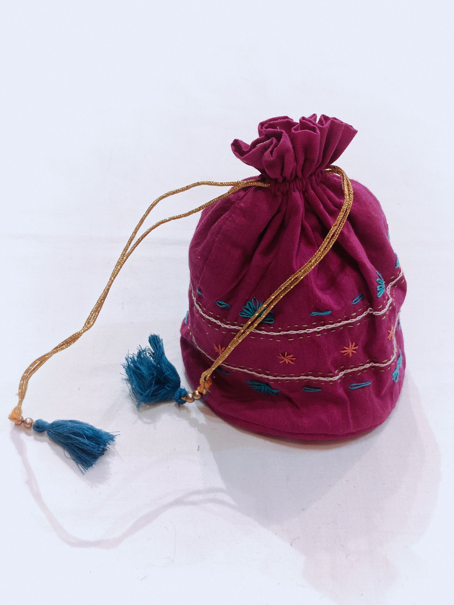 Pink hand embroidered cotton potli with base