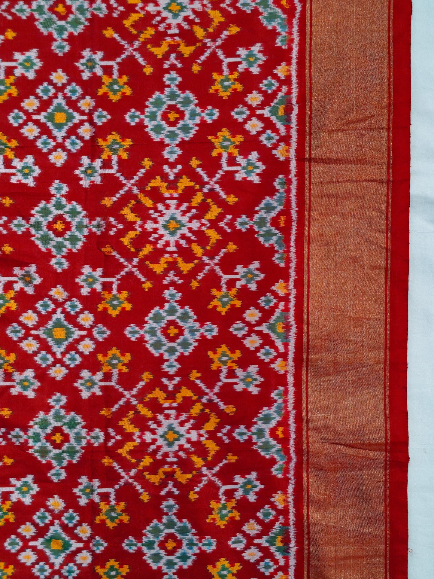 Orange and green flowers on red base ikat silk handwoven fabric with border