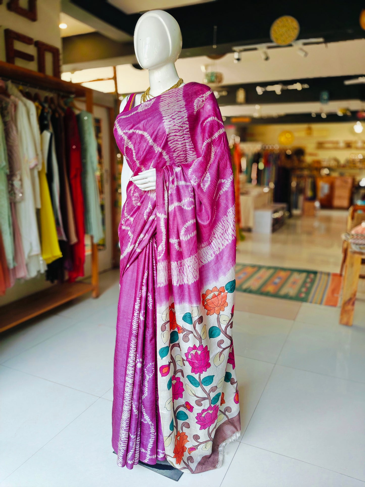 Pink tussar silk saree with needle shibori body and hand painted lotus design pallu