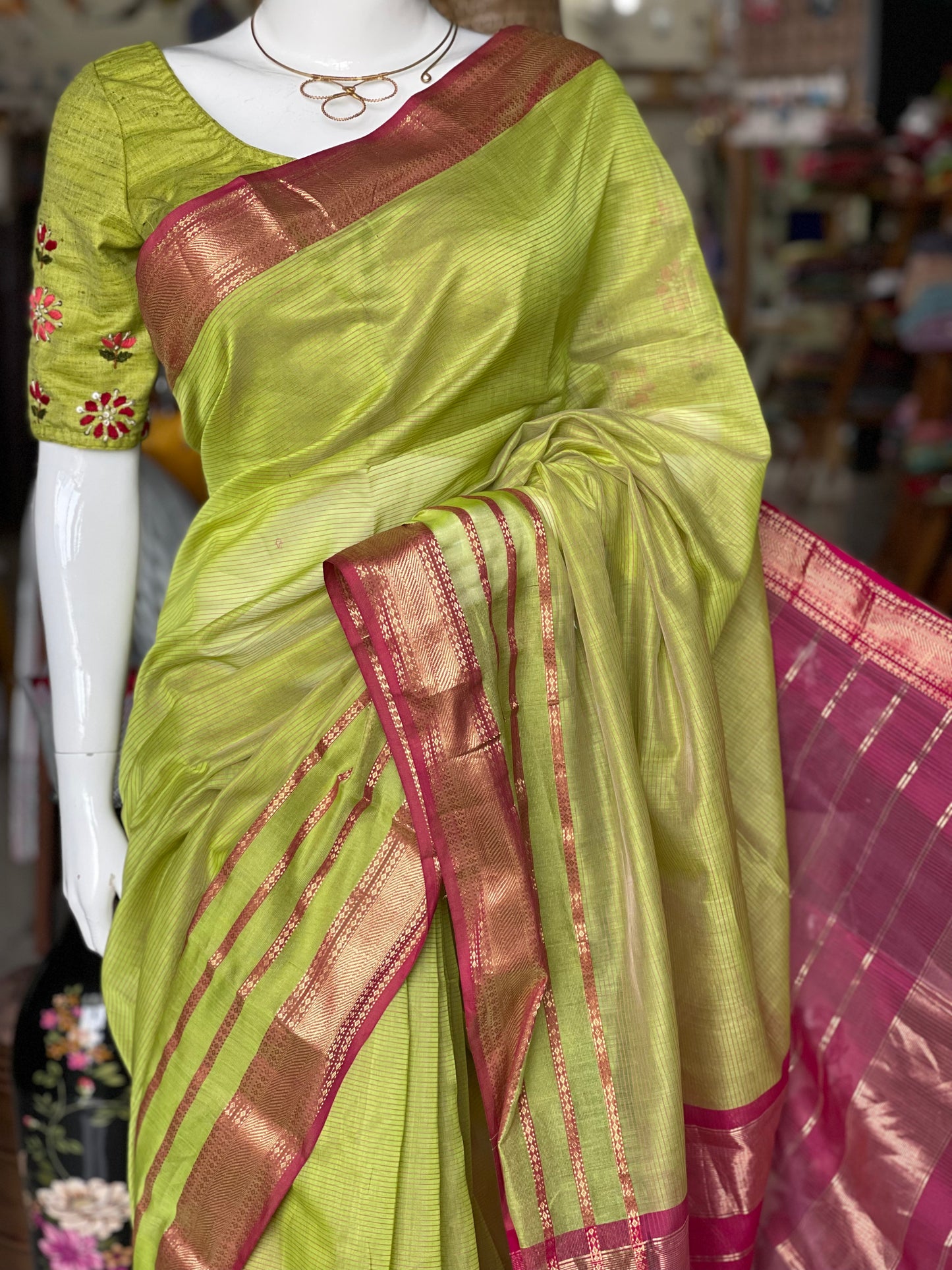 Parrot green silk cotton Maheshwari handloom saree with multiple thin stripes pink border