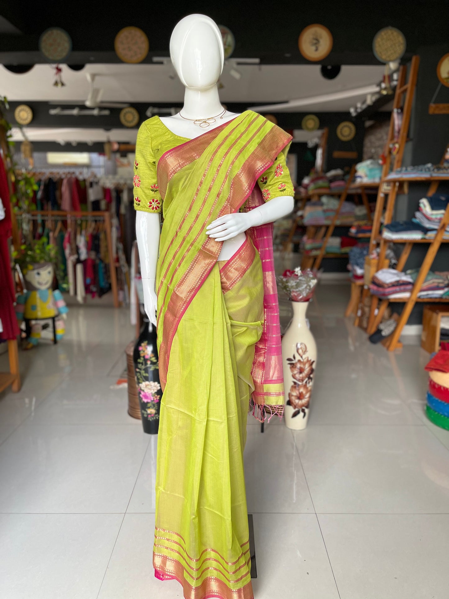 Parrot green silk cotton Maheshwari handloom saree with multiple thin stripes pink border